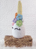 Handmade unicorn crochet plushie shown from the front