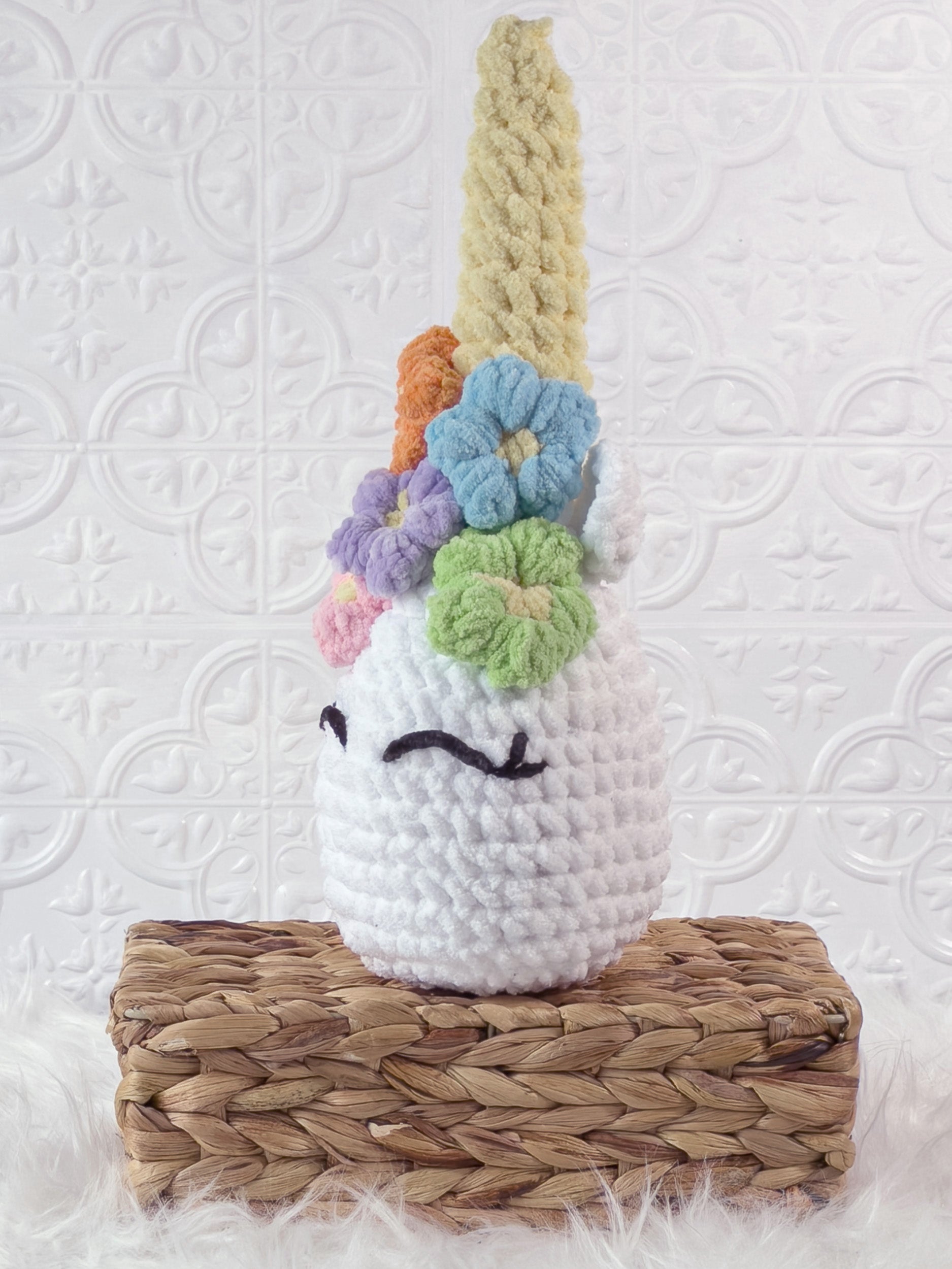 Handmade unicorn crochet plushie shown from the front