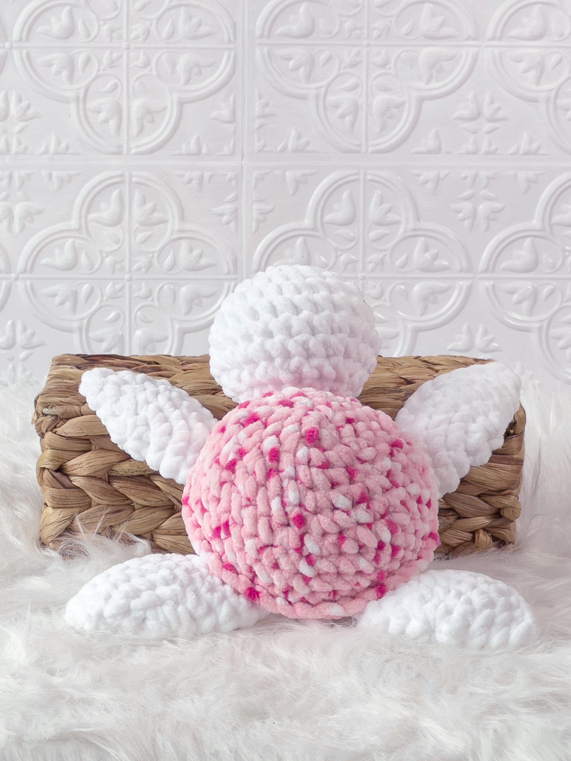 Handmade multicolor, pink turtle crochet plushie shown from the back