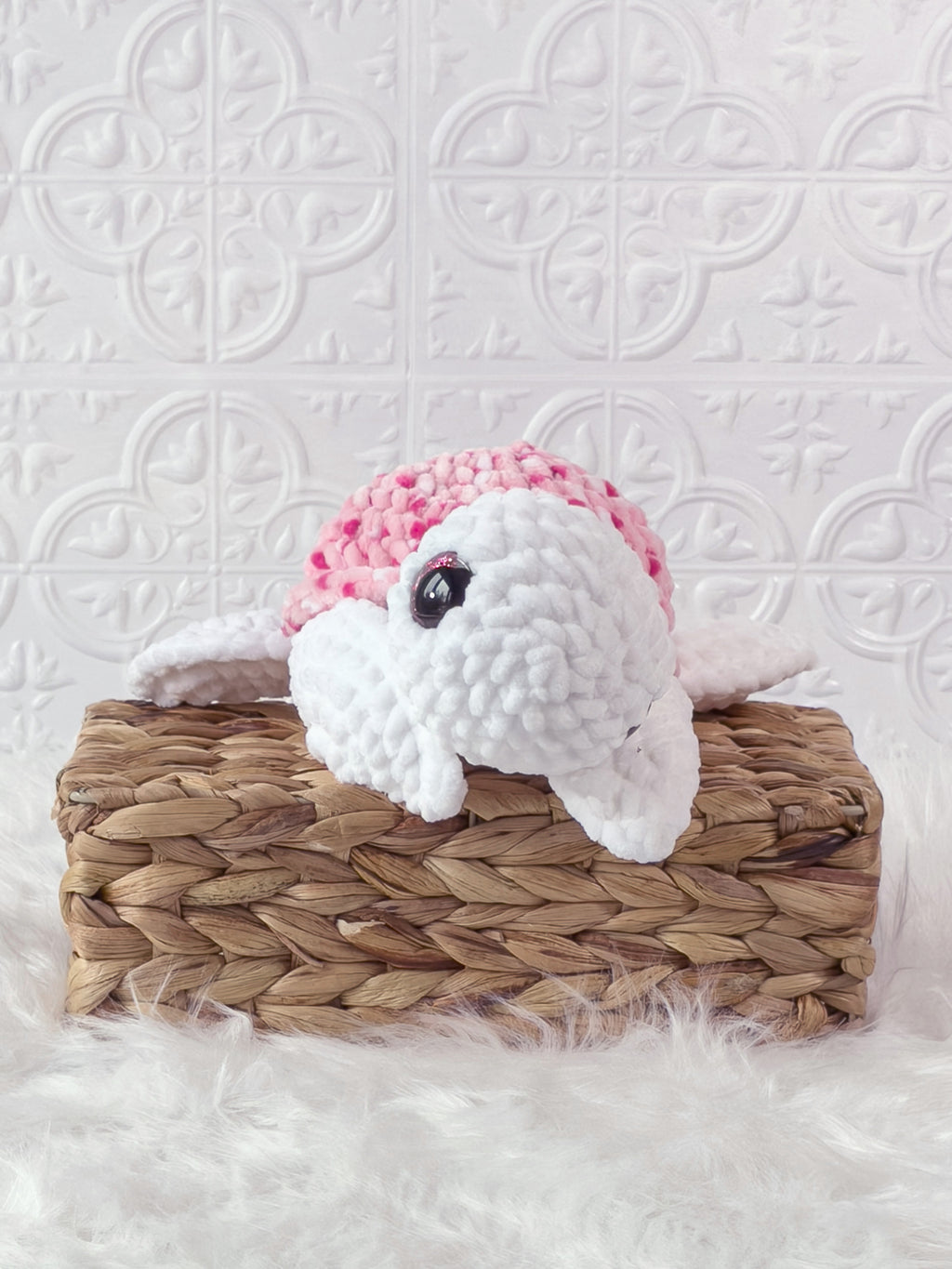 Handmade multicolor, pink turtle crochet plushie shown from the front