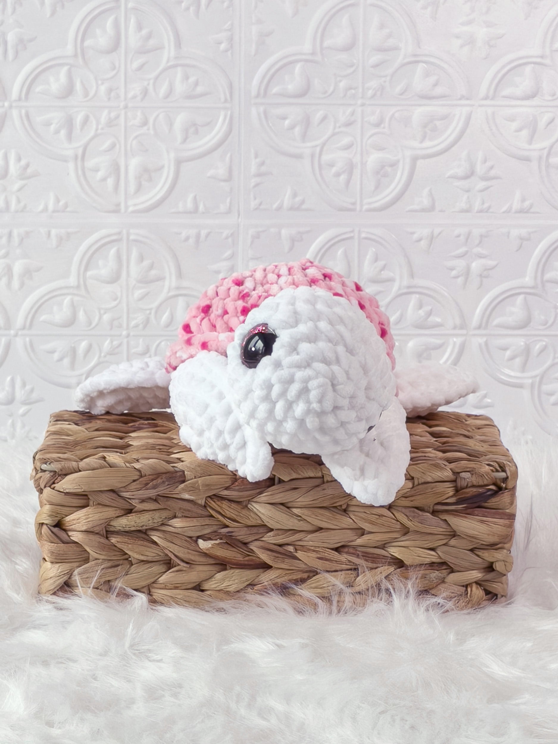 Handmade multicolor, pink turtle crochet plushie shown from the front