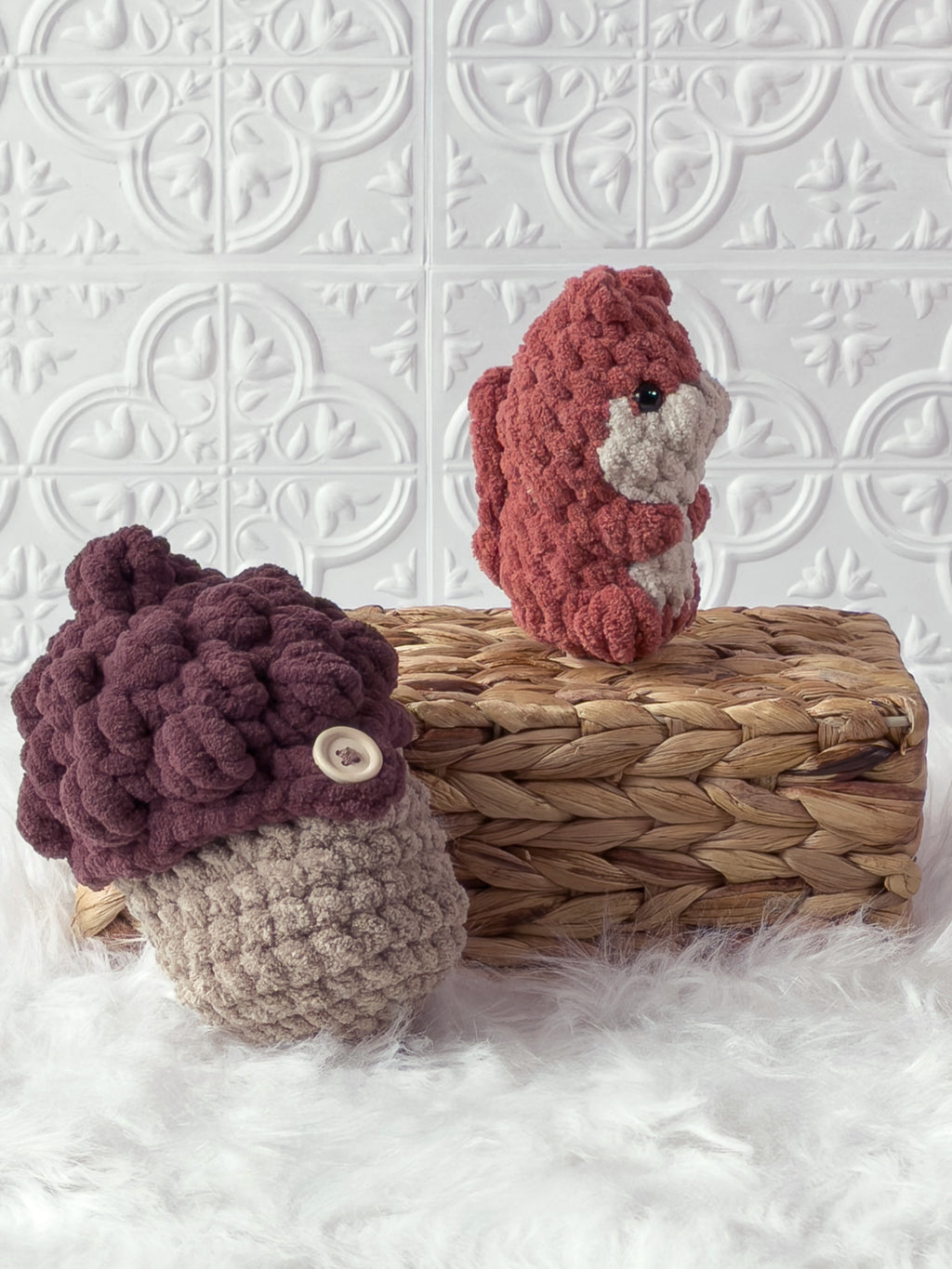 Handmade orange, brown peek a boo squirrel in acorn crochet plushie shown from an angled view
