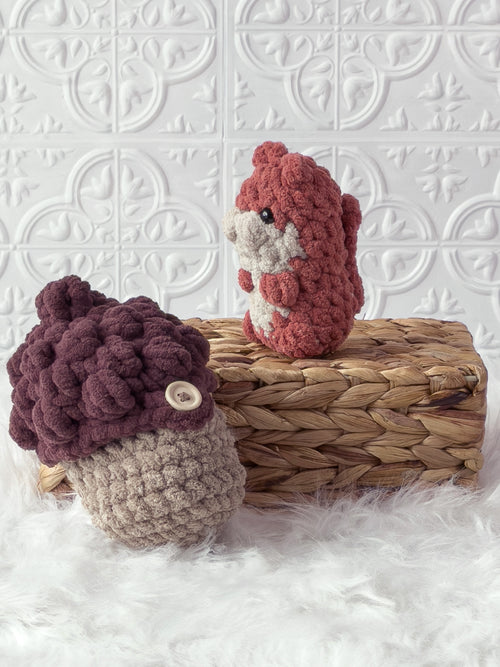 Handmade peek-a-boo squirrel crochet plushie inside a crochet acorn