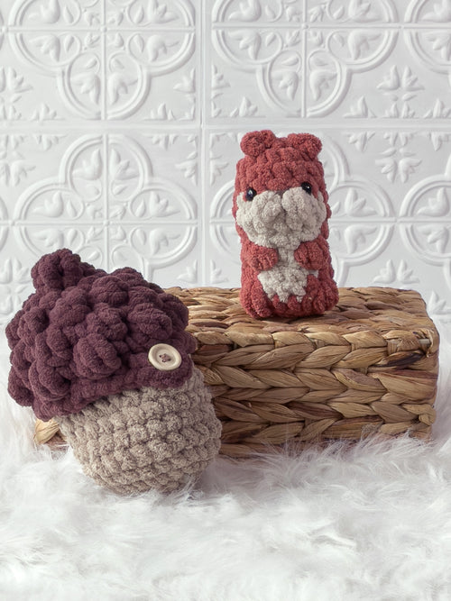 Handmade orange, brown peek a boo squirrel in acorn crochet plushie shown from the front