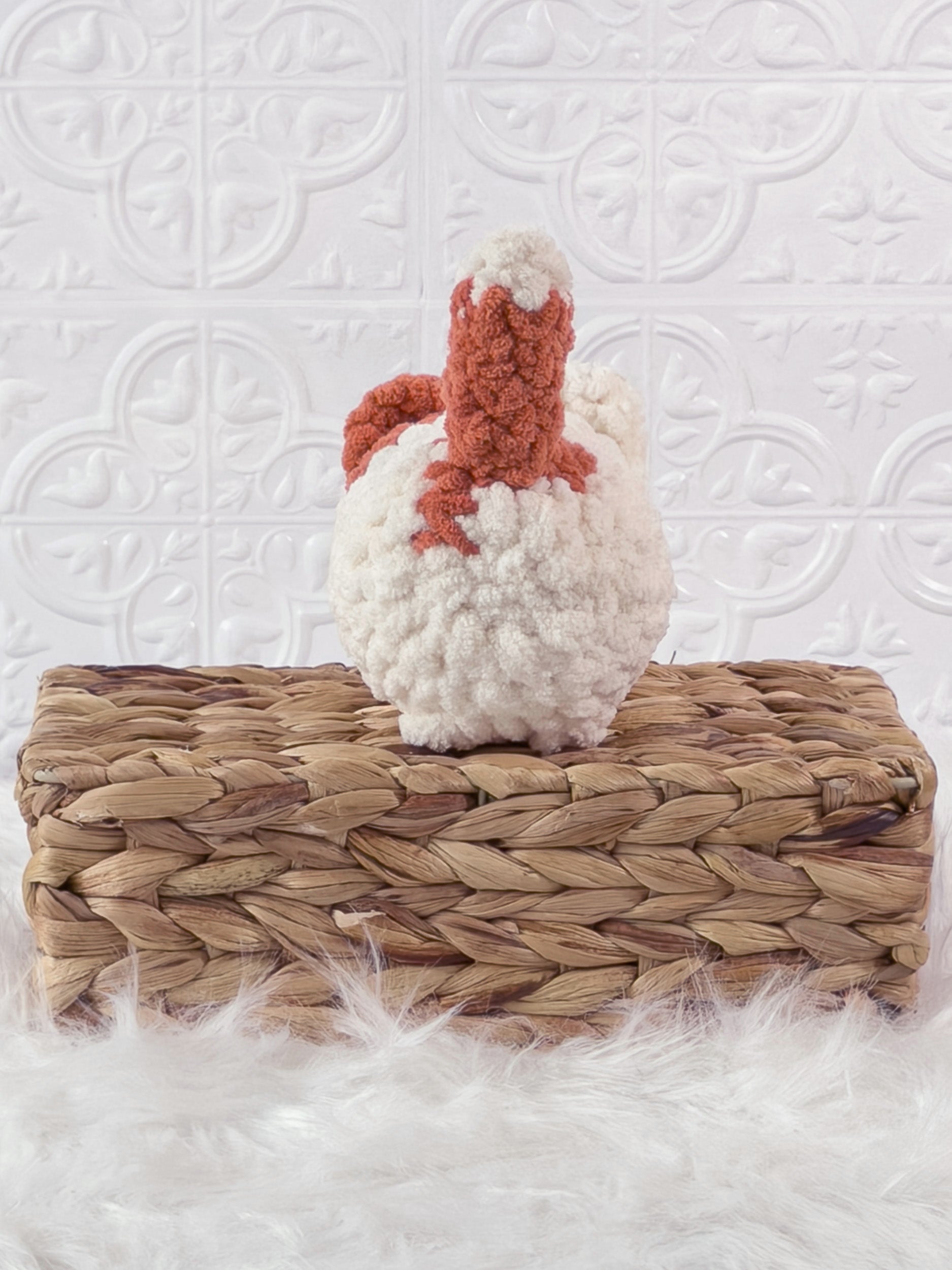 Handmade orange, cream loaf cat crochet plushie shown from the back