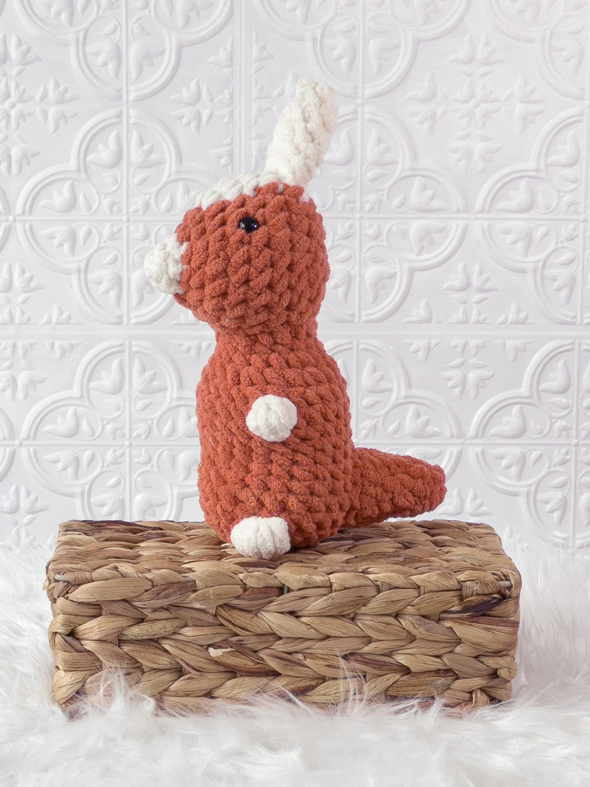 Handmade parasaurolophus crochet plushie shown from the front