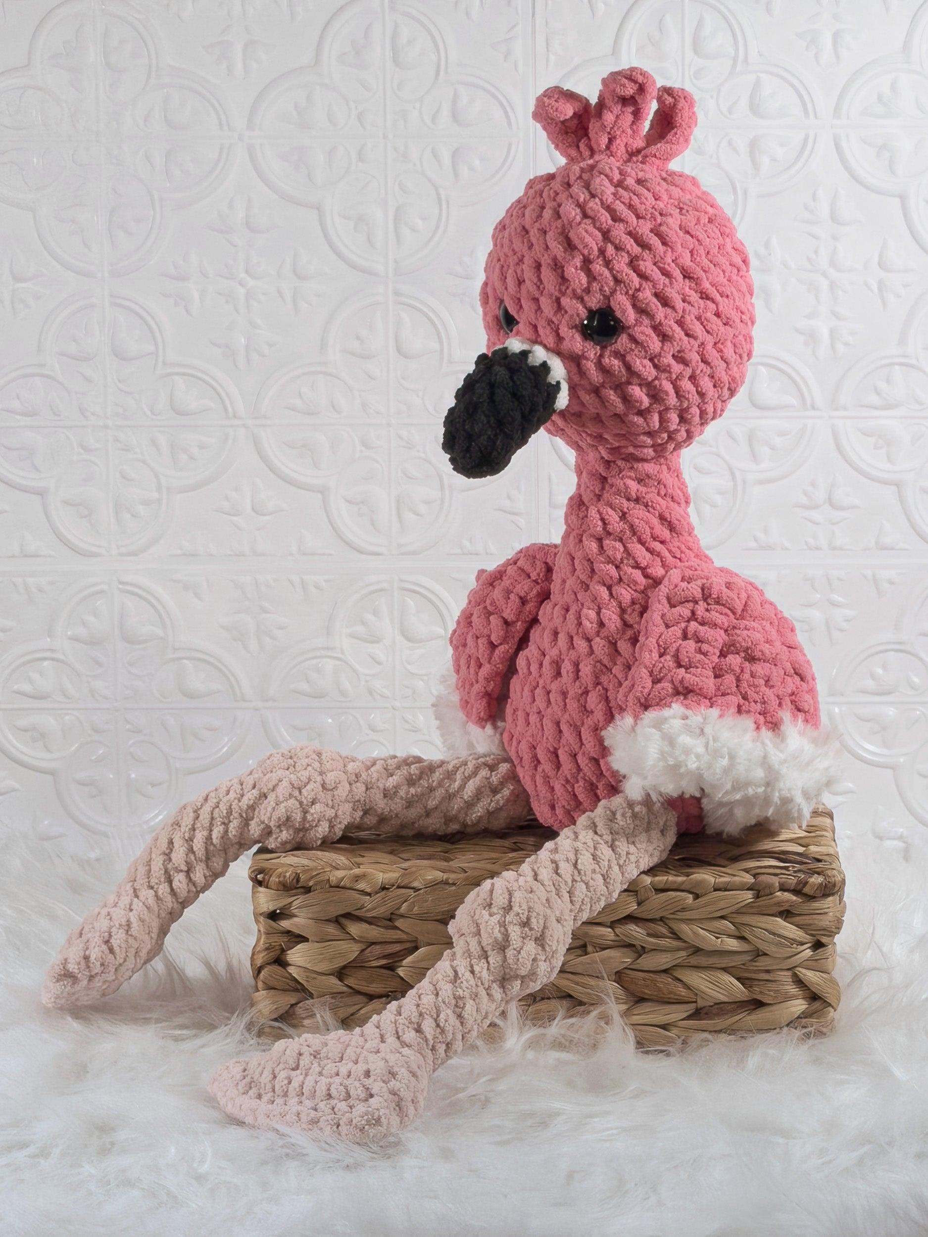 Handmade flamingo crochet plushie shown from the front