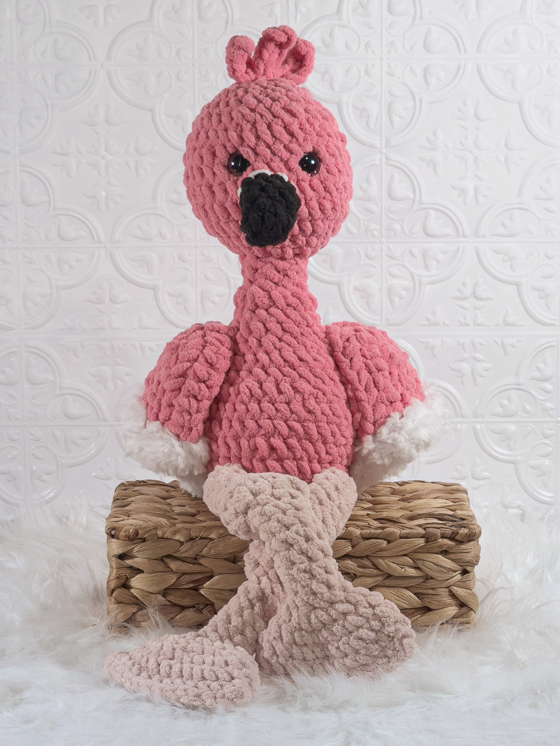 Handmade pink flamingo crochet plushie shown from the front