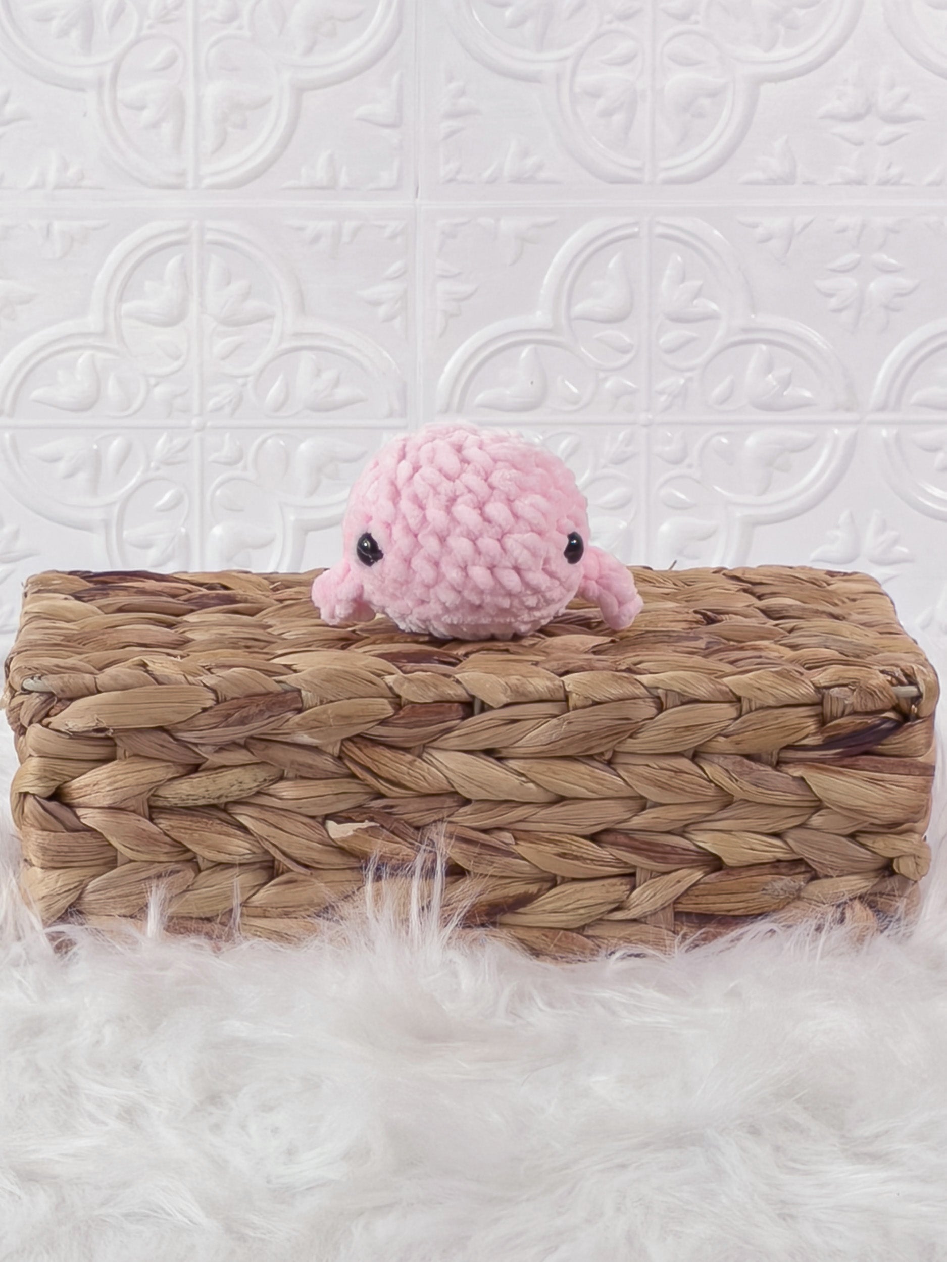 Small handmade whale crochet plushie shown from the front