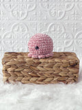 Handmade octopus crochet plushie shown from the front