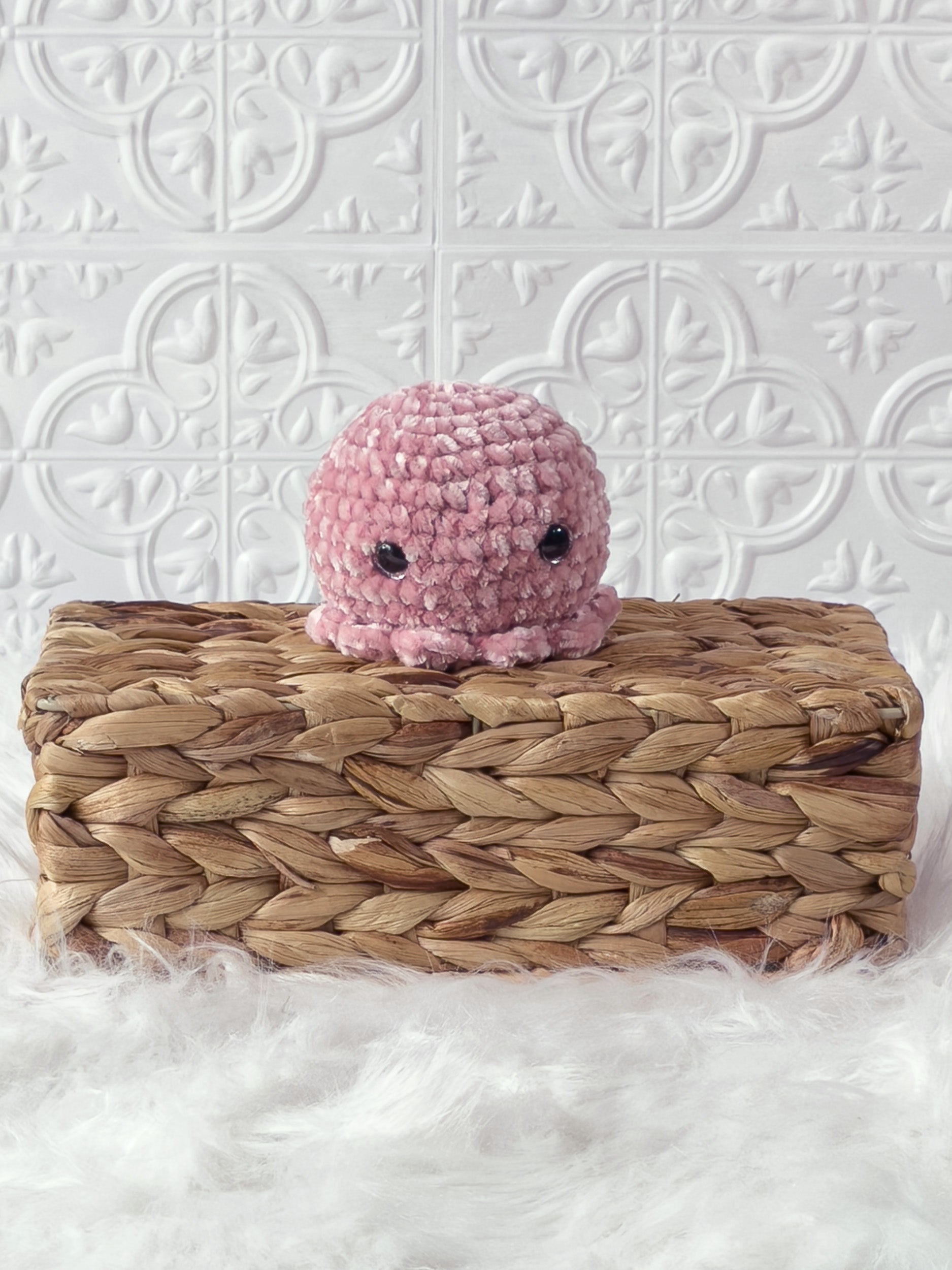 Handmade pink octopus crochet plushie shown from the front