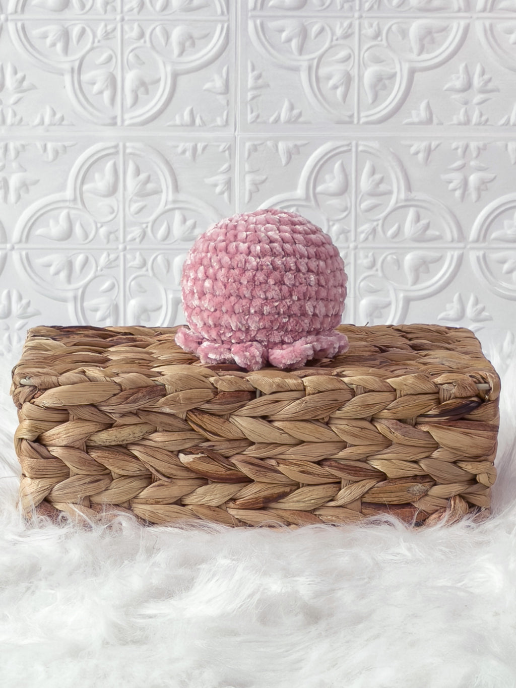 Handmade pink octopus crochet plushie shown from the back