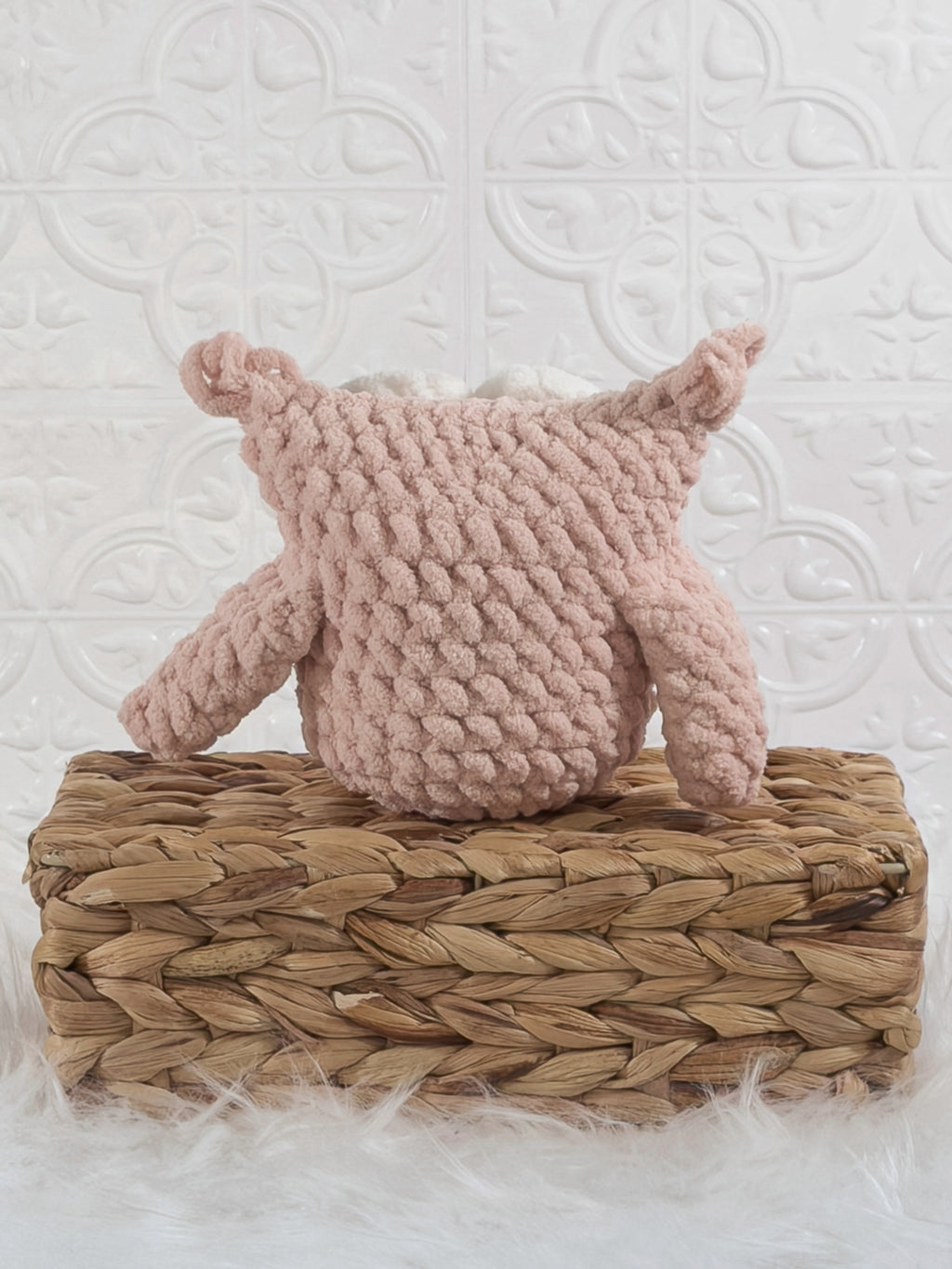 Handmade pink owl crochet plushie shown from the back