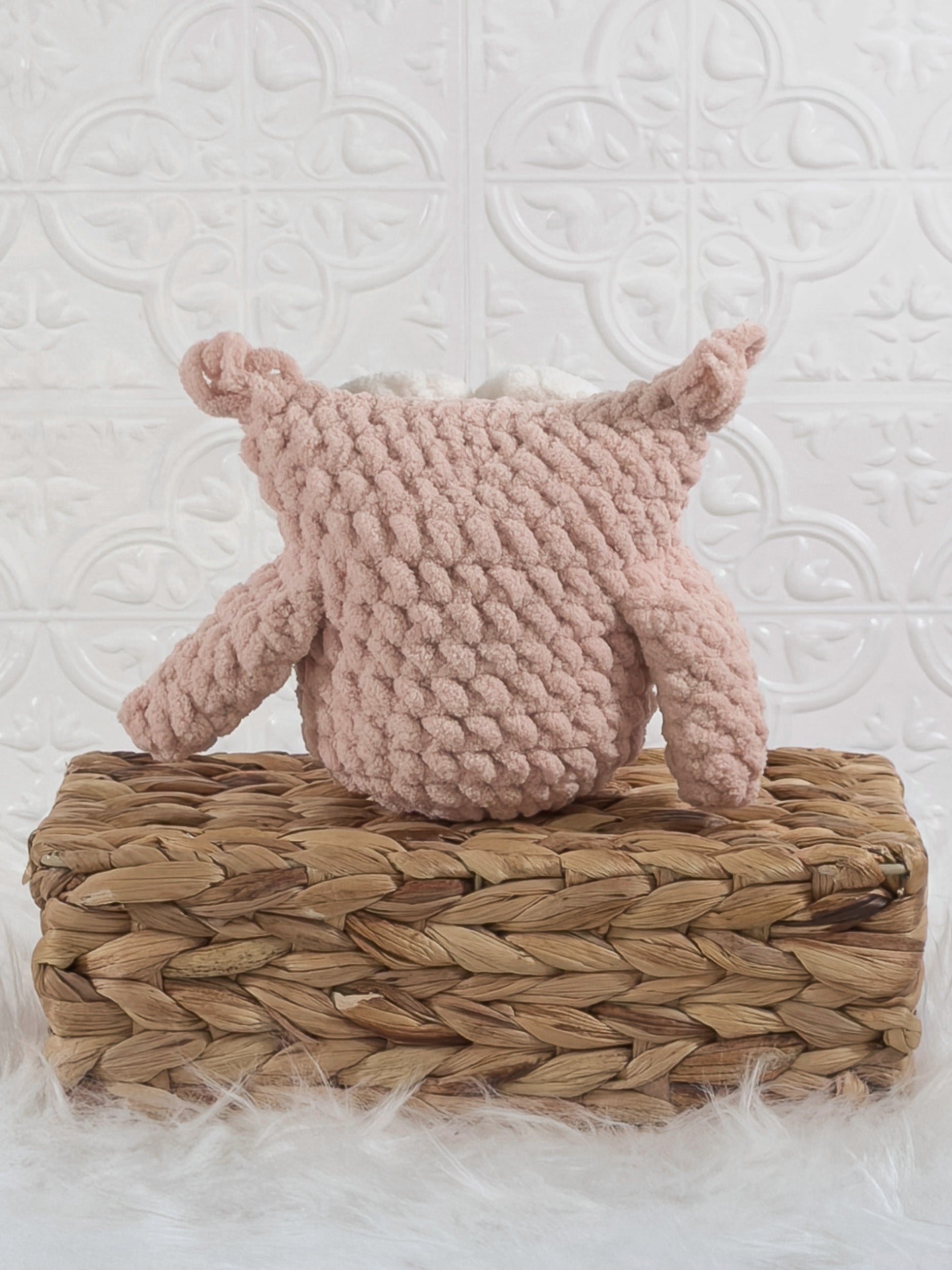 Handmade pink owl crochet plushie shown from the back
