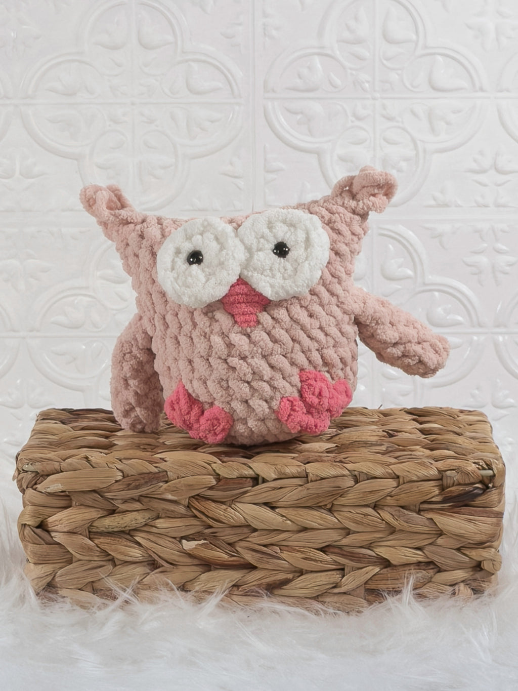 Handmade pink owl crochet plushie shown from the front