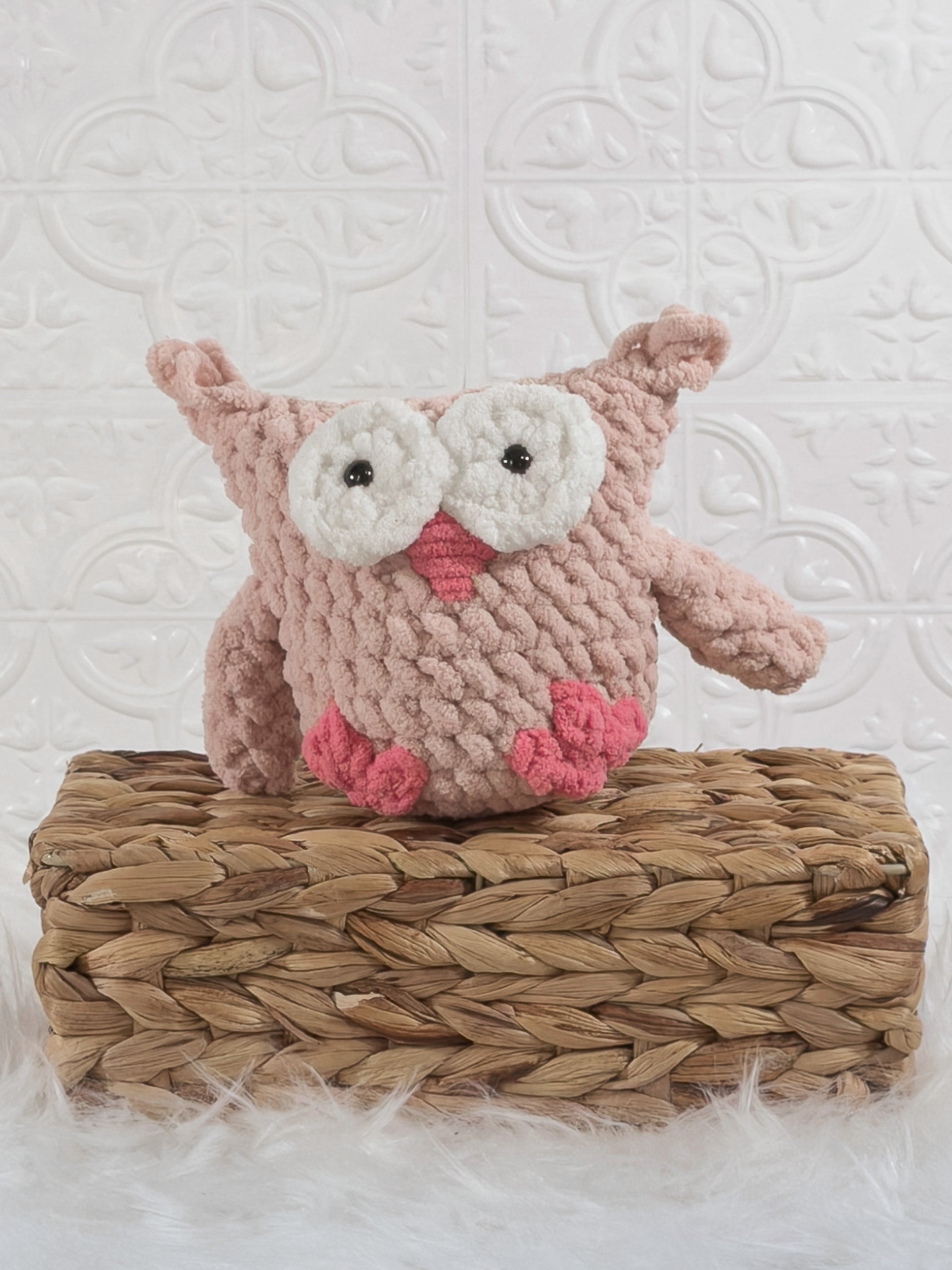 Handmade pink owl crochet plushie shown from the front