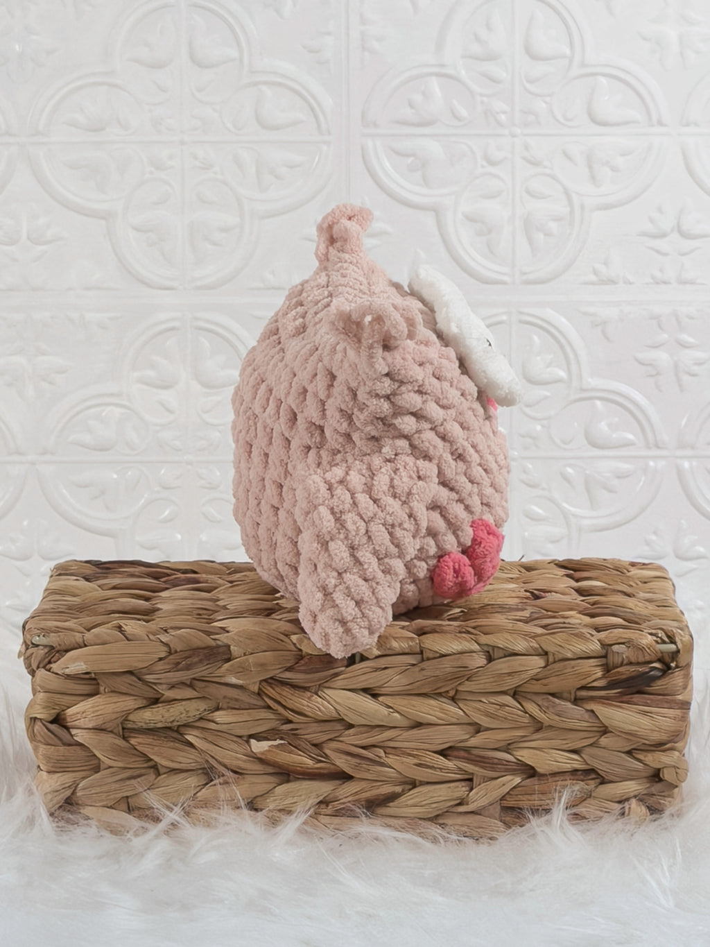 Handmade pink owl crochet plushie shown from the side