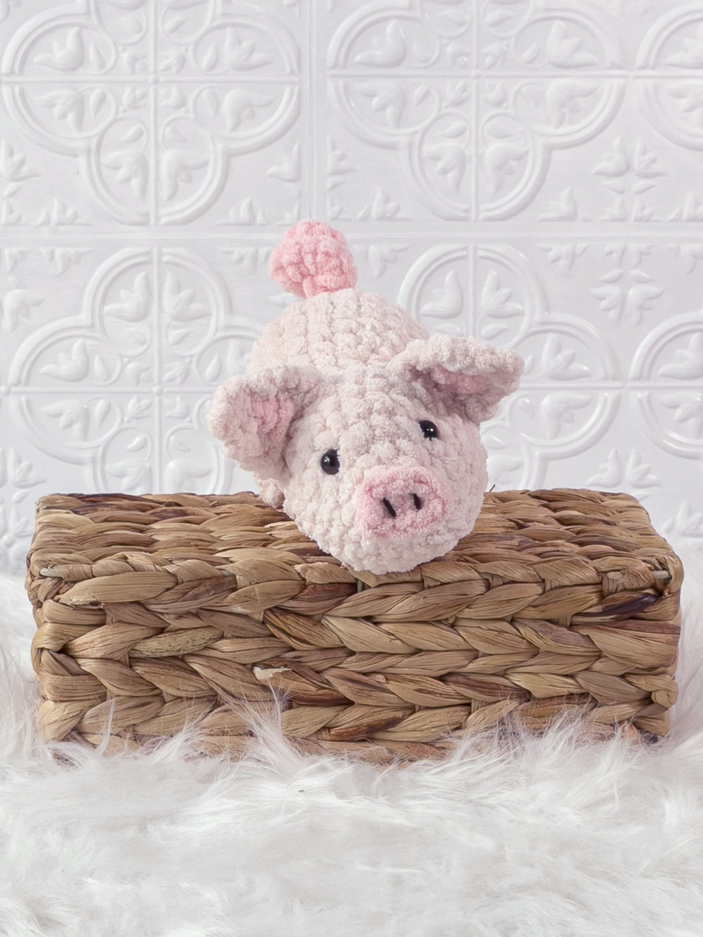 Handmade pink pig crochet plushie shown from the front