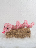 Handmade snake crochet plushie shown from the front