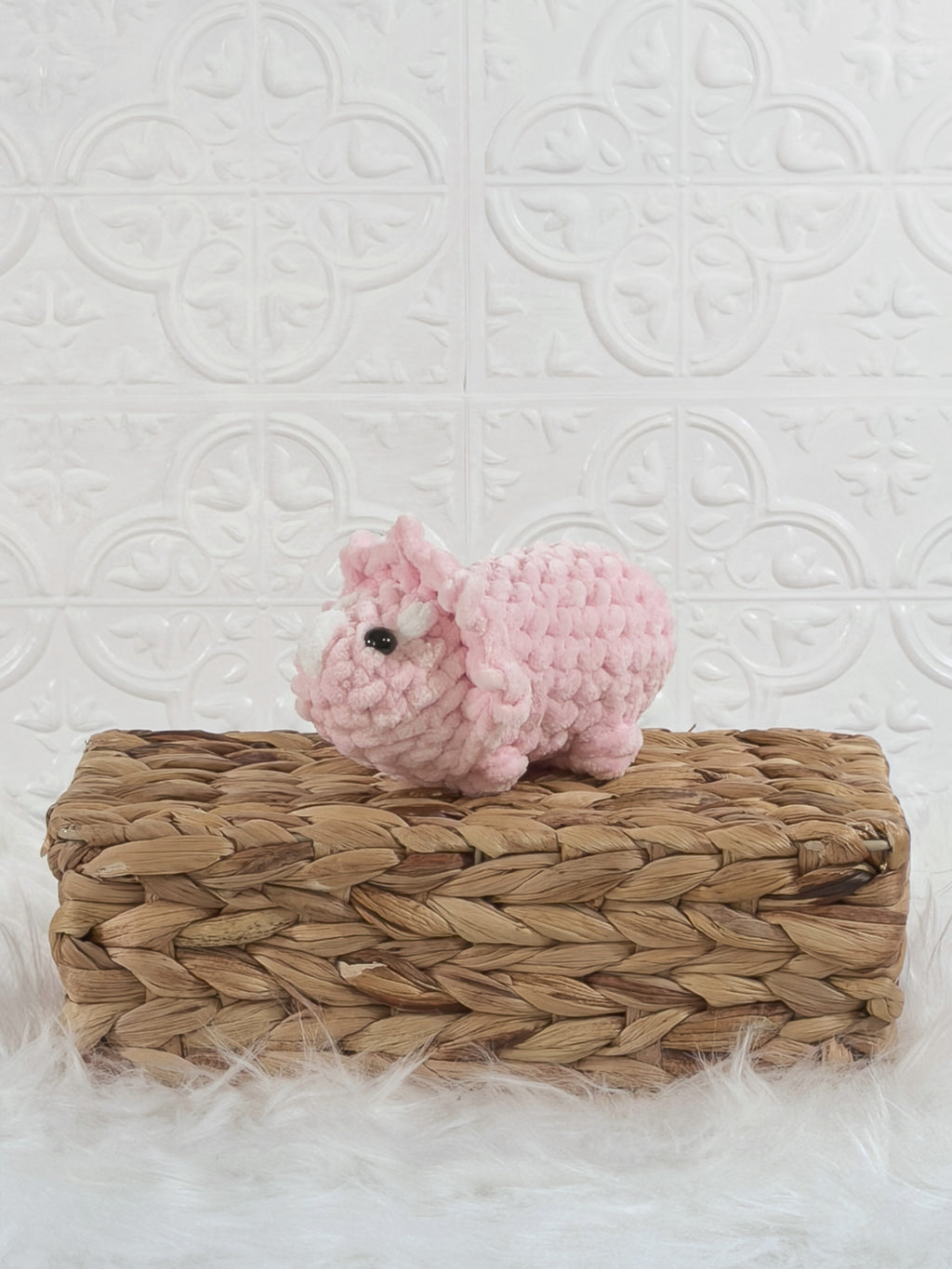 Handmade triceratops crochet plushie shown from the front