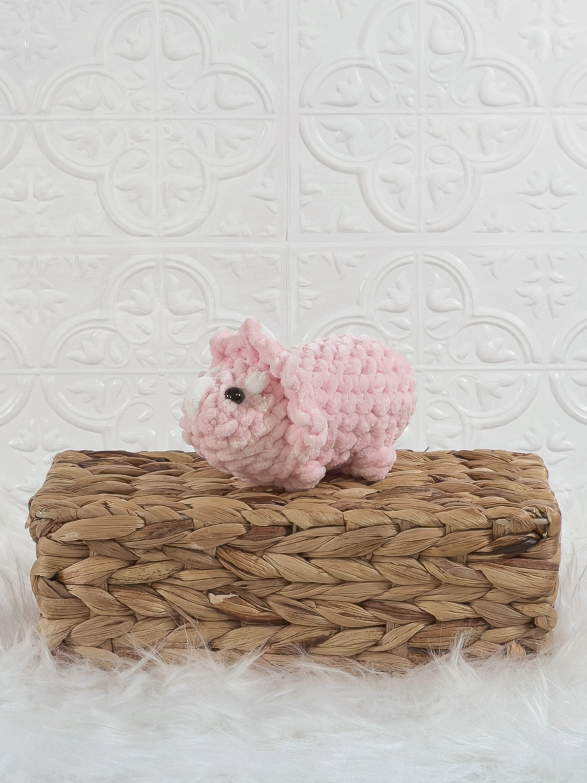 Handmade triceratops crochet plushie shown from the front