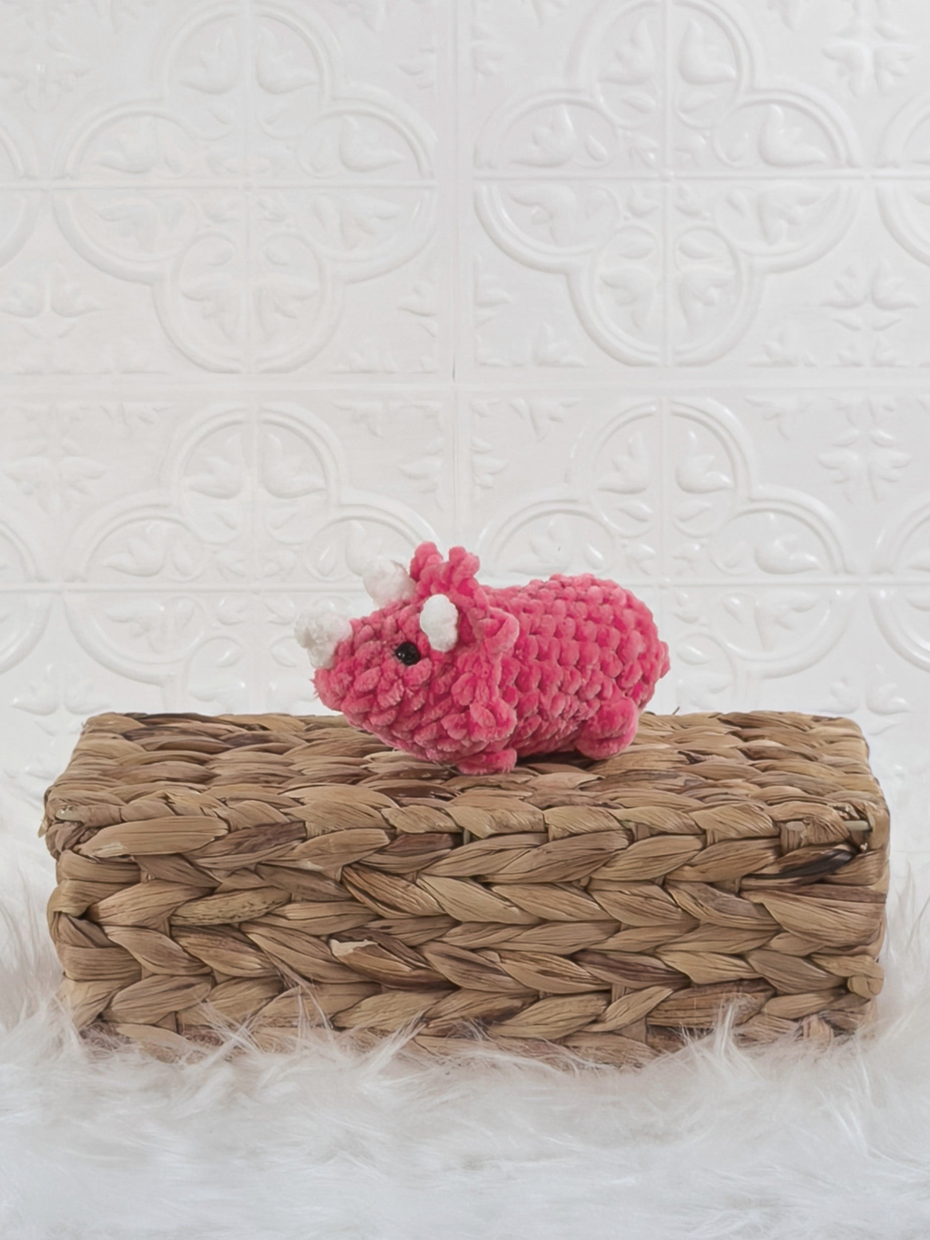 Handmade triceratops crochet plushie shown from the front