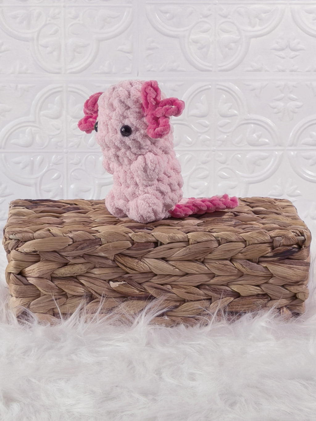 Handmade axolotl crochet plushie shown from the front