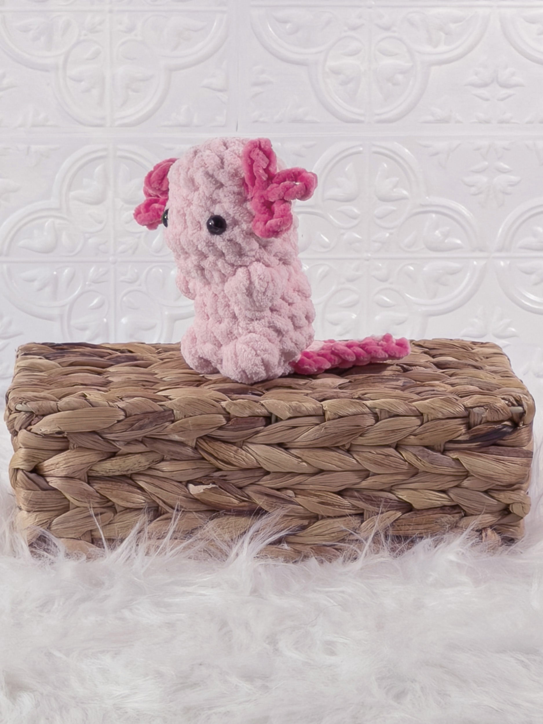 Handmade axolotl crochet plushie shown from the front