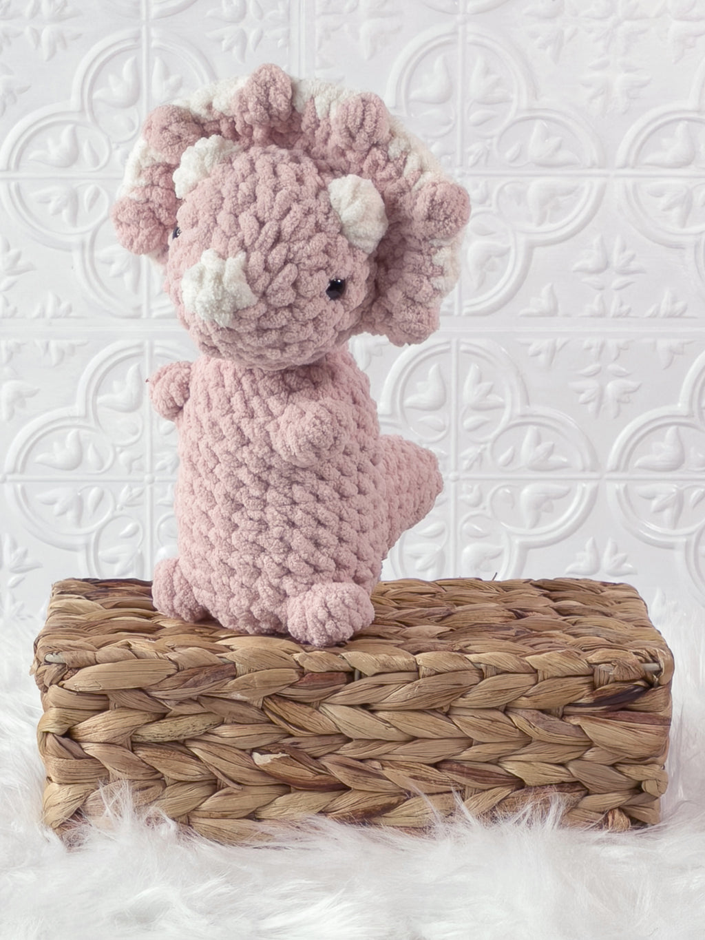 Handmade triceratops crochet plushie shown from the front