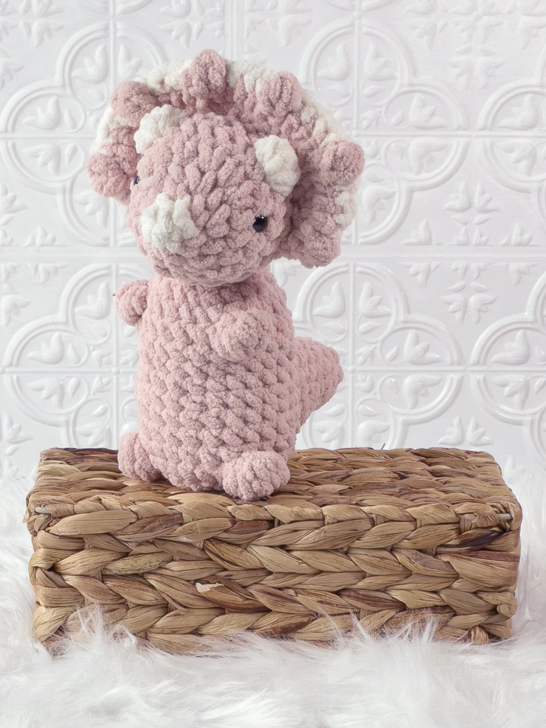 Handmade triceratops crochet plushie shown from the front
