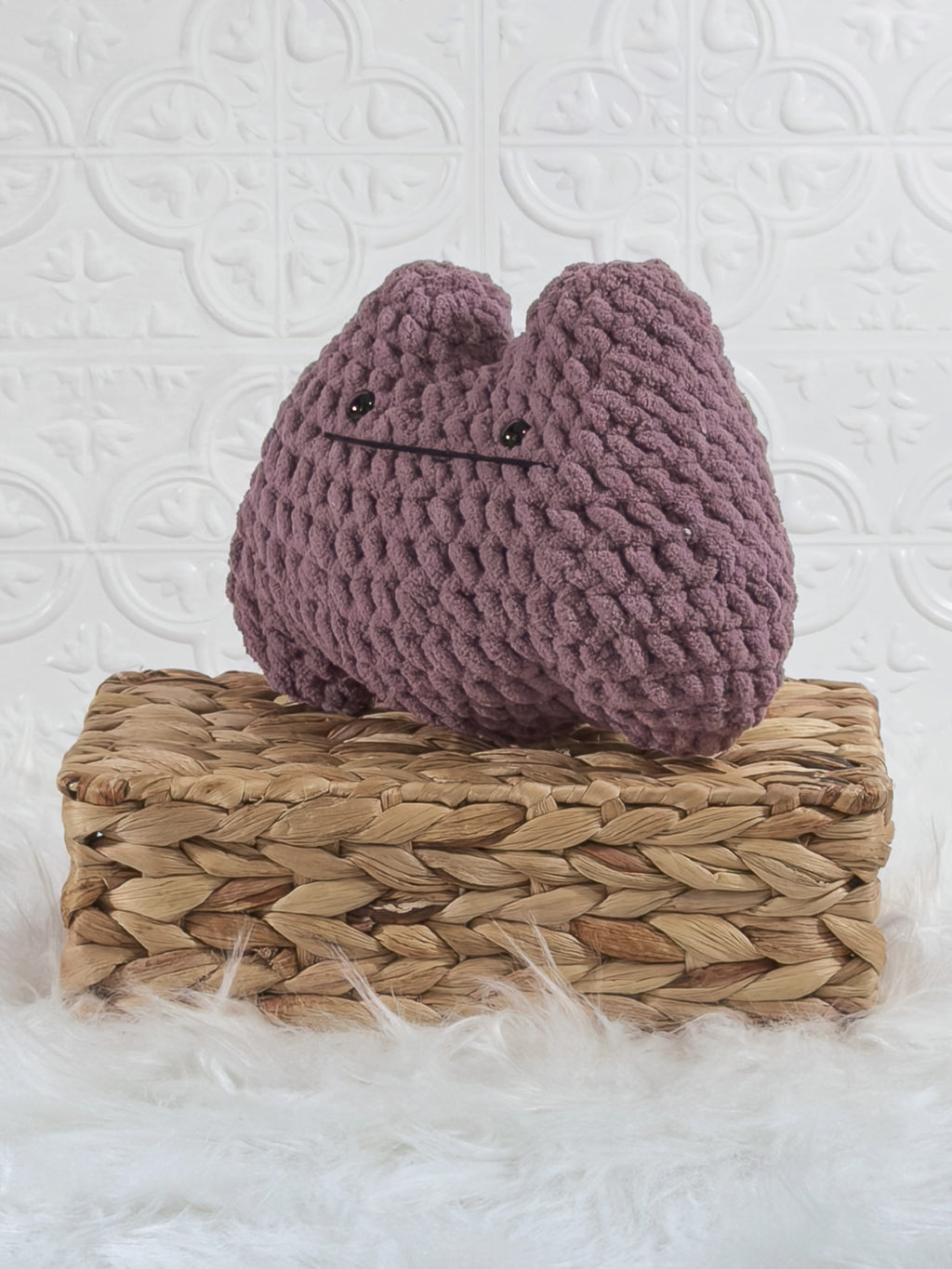 Handmade Ditto crochet plushie with a simple rounded character-inspired shape