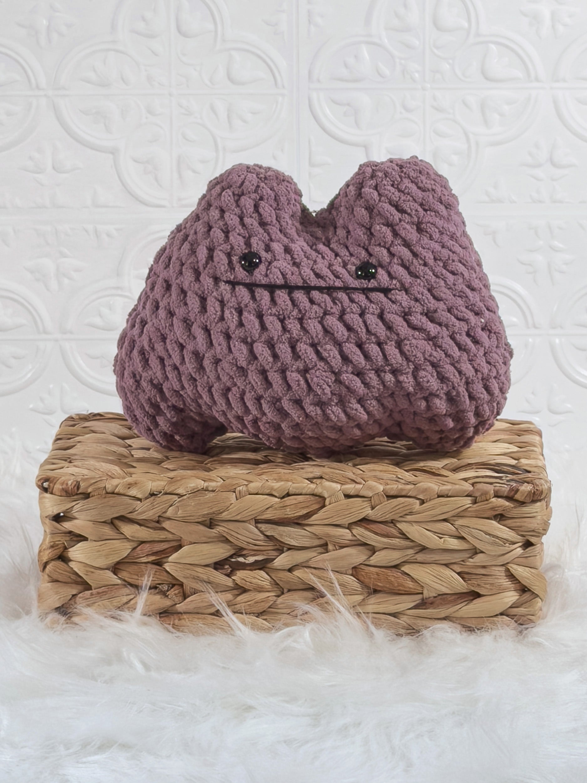 Handmade purple ditto crochet plushie shown from the front