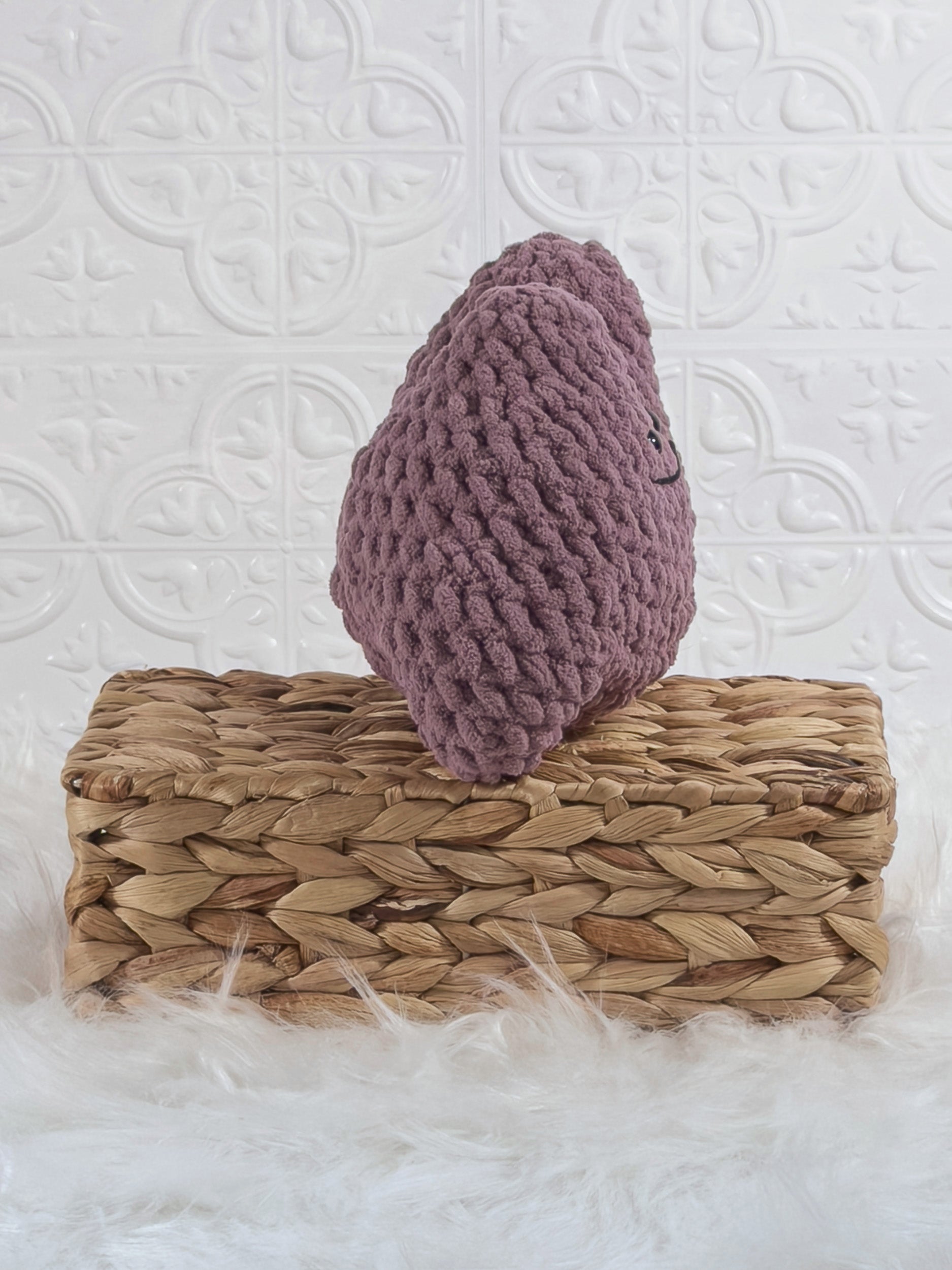 Handmade purple ditto crochet plushie shown from the side
