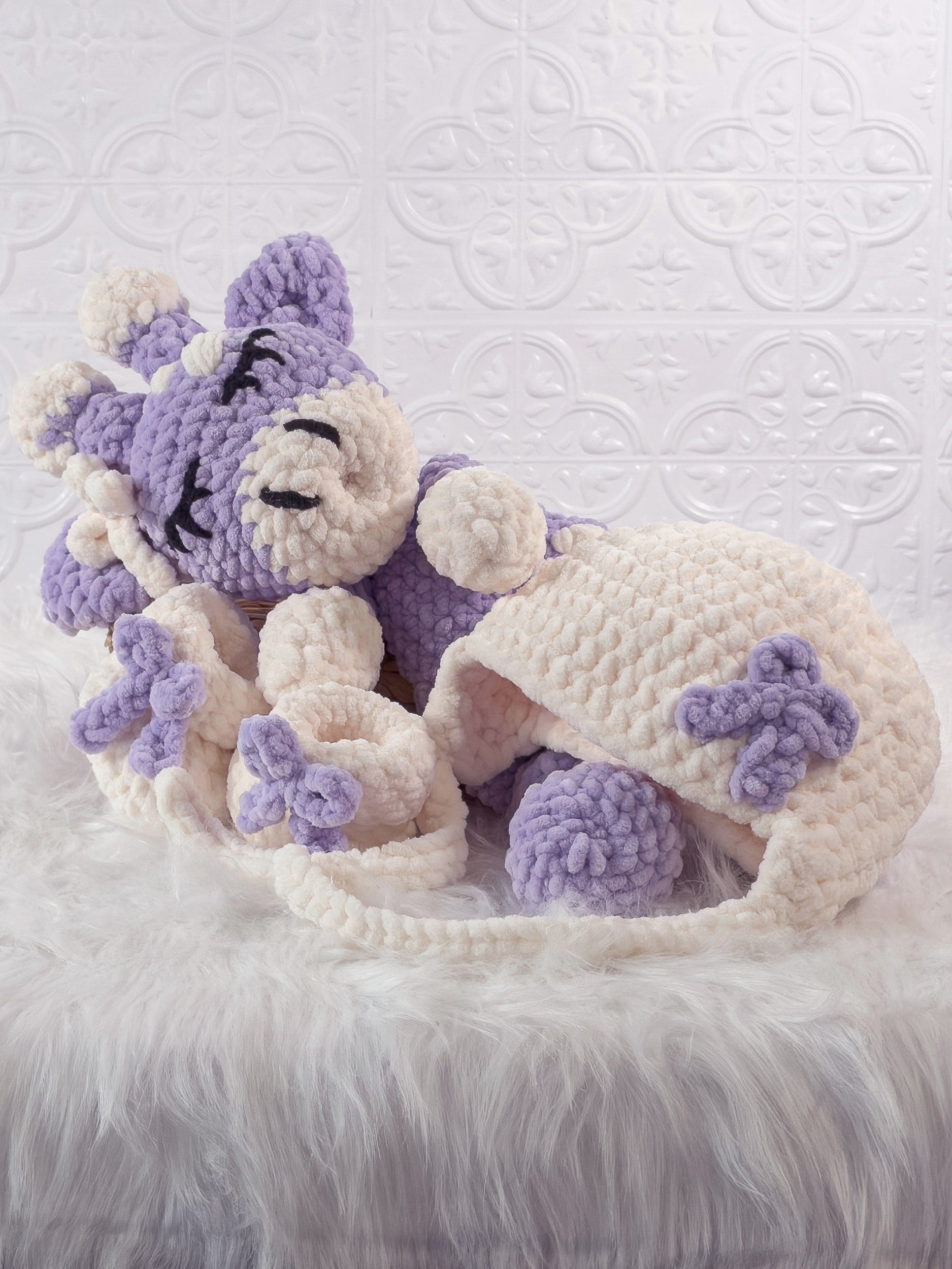 Handmade purple giraffe crochet snuggler shown from an angled view