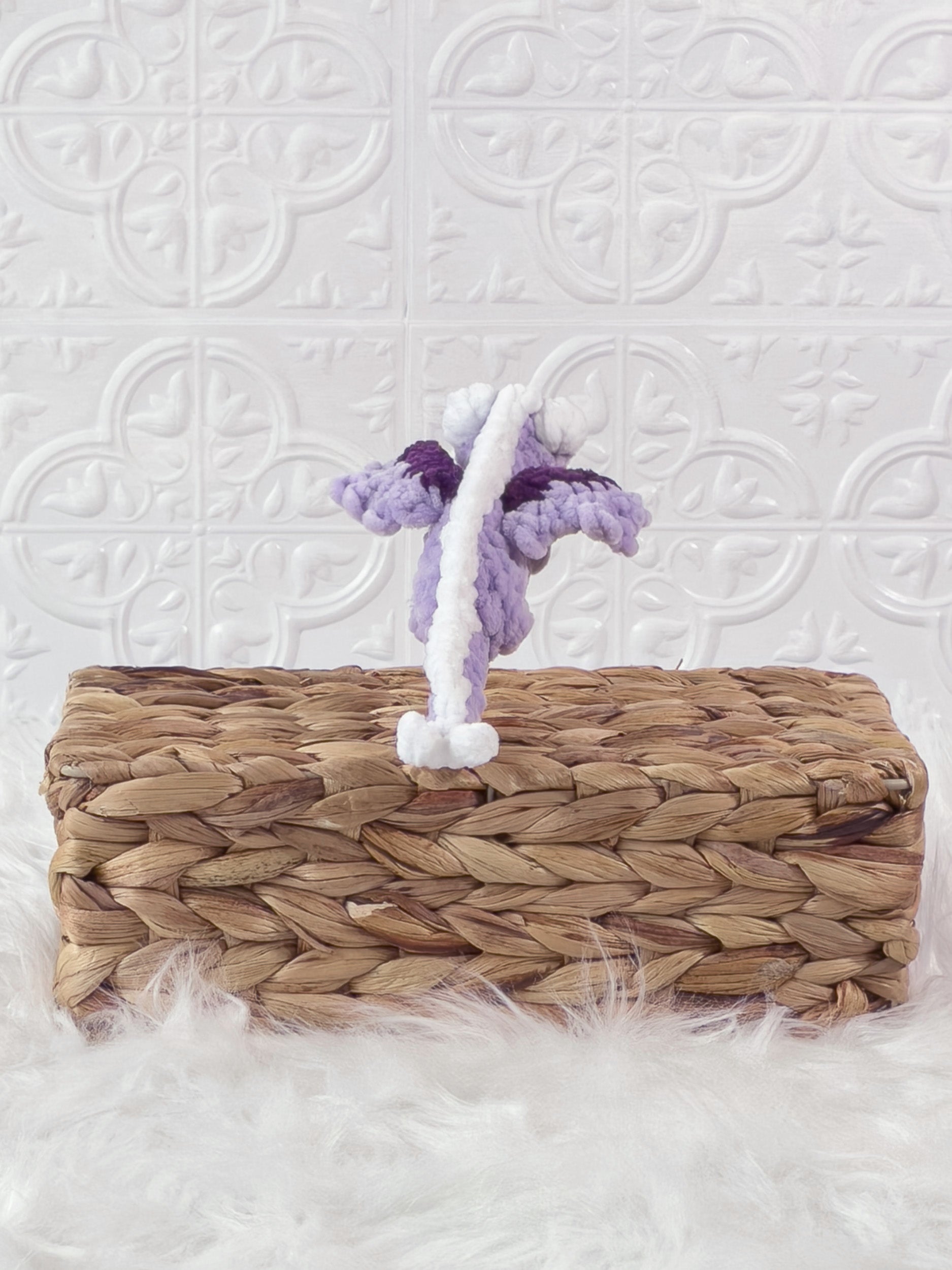 Handmade purple mini dragon crochet plushie shown from the back