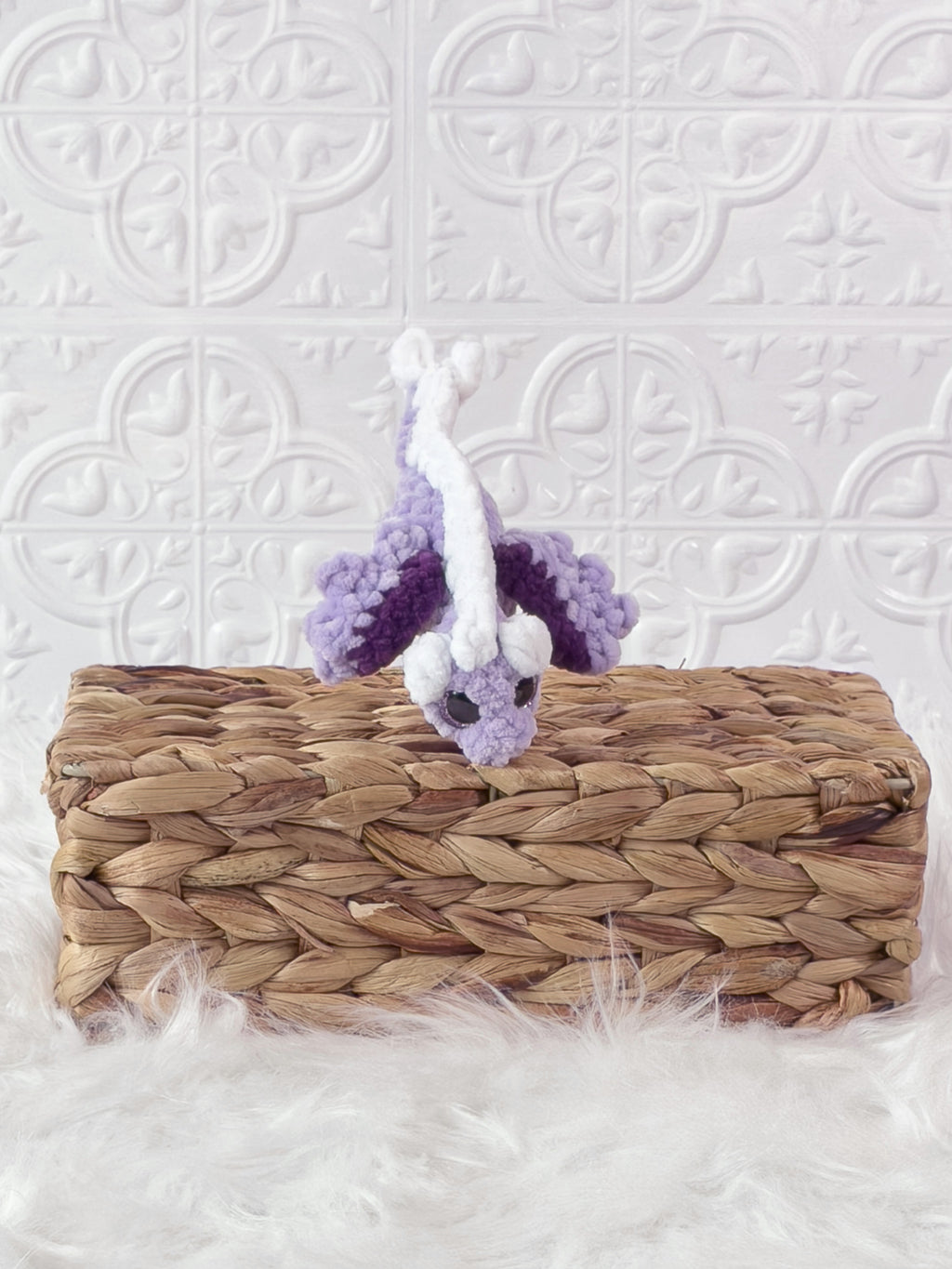 Handmade purple mini dragon crochet plushie shown from the front