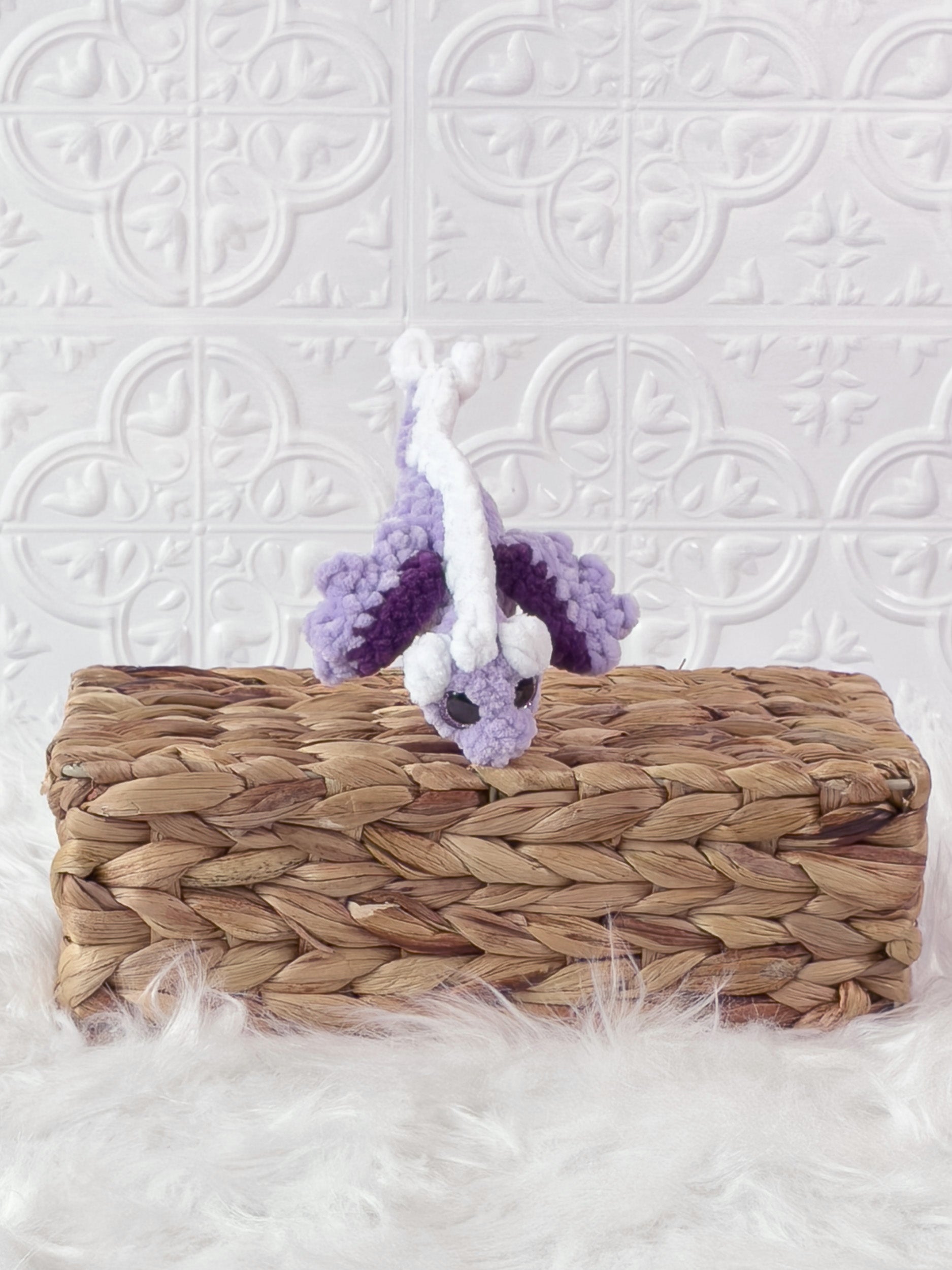 Handmade purple mini dragon crochet plushie shown from the front