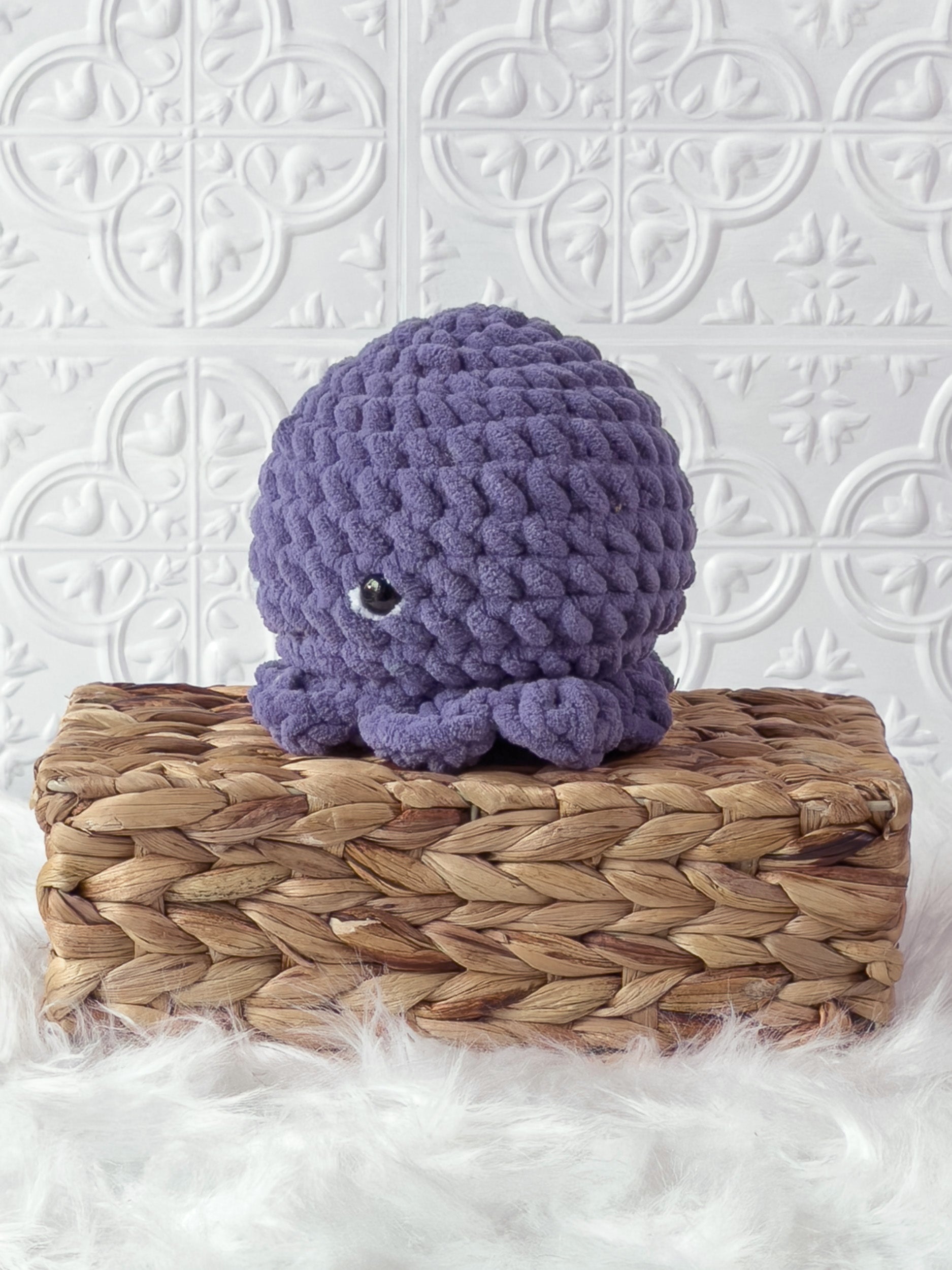 Handmade octopus crochet plushie shown from the front