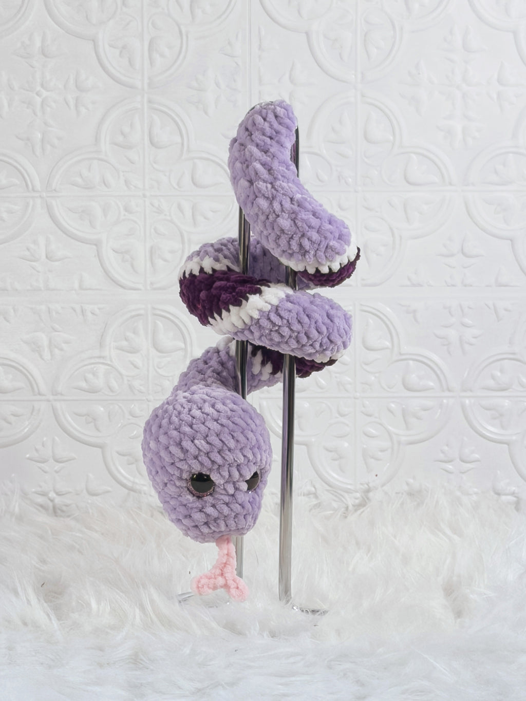Handmade purple snake crochet plushie shown from the back
