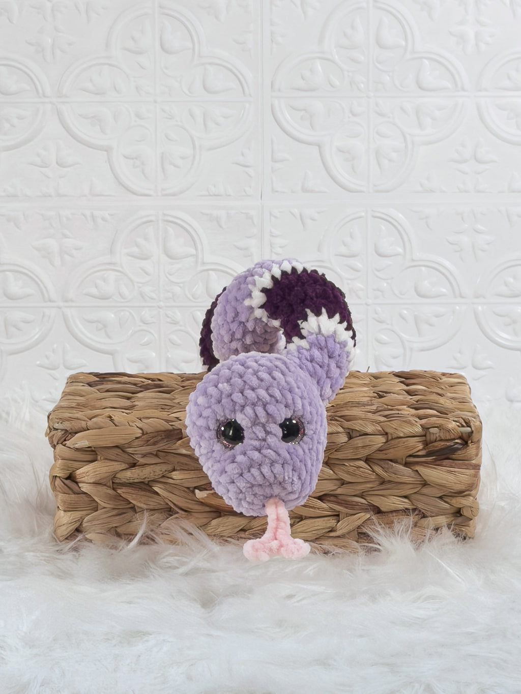 Handmade purple snake crochet plushie shown from the front