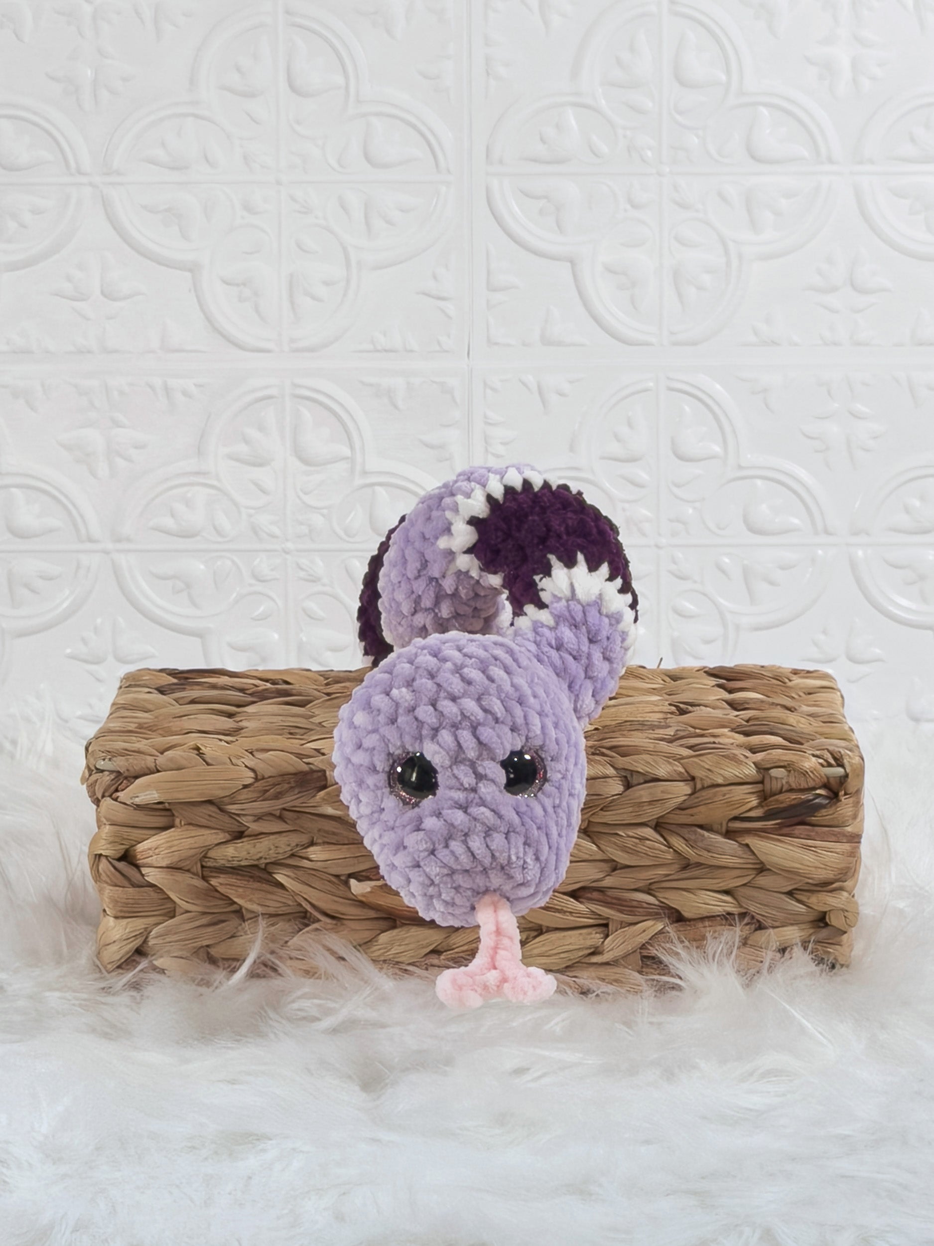 Handmade purple snake crochet plushie shown from the front