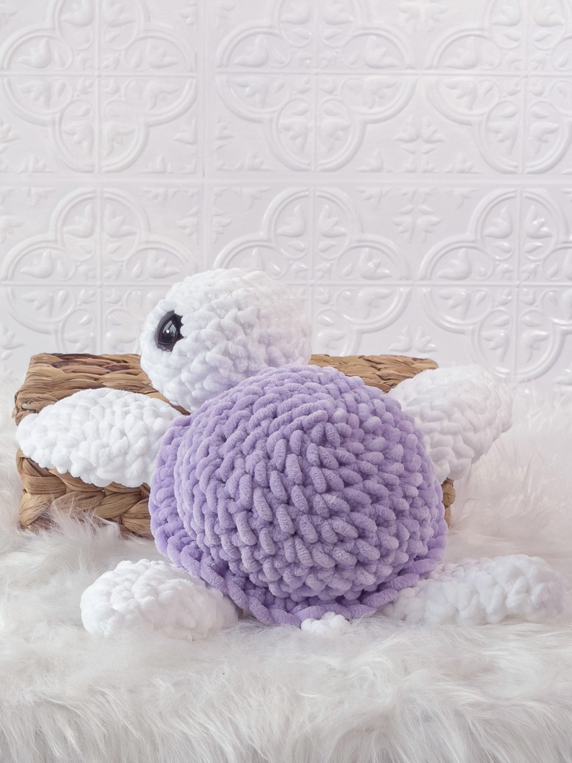Handmade purple turtle crochet plushie shown from the back