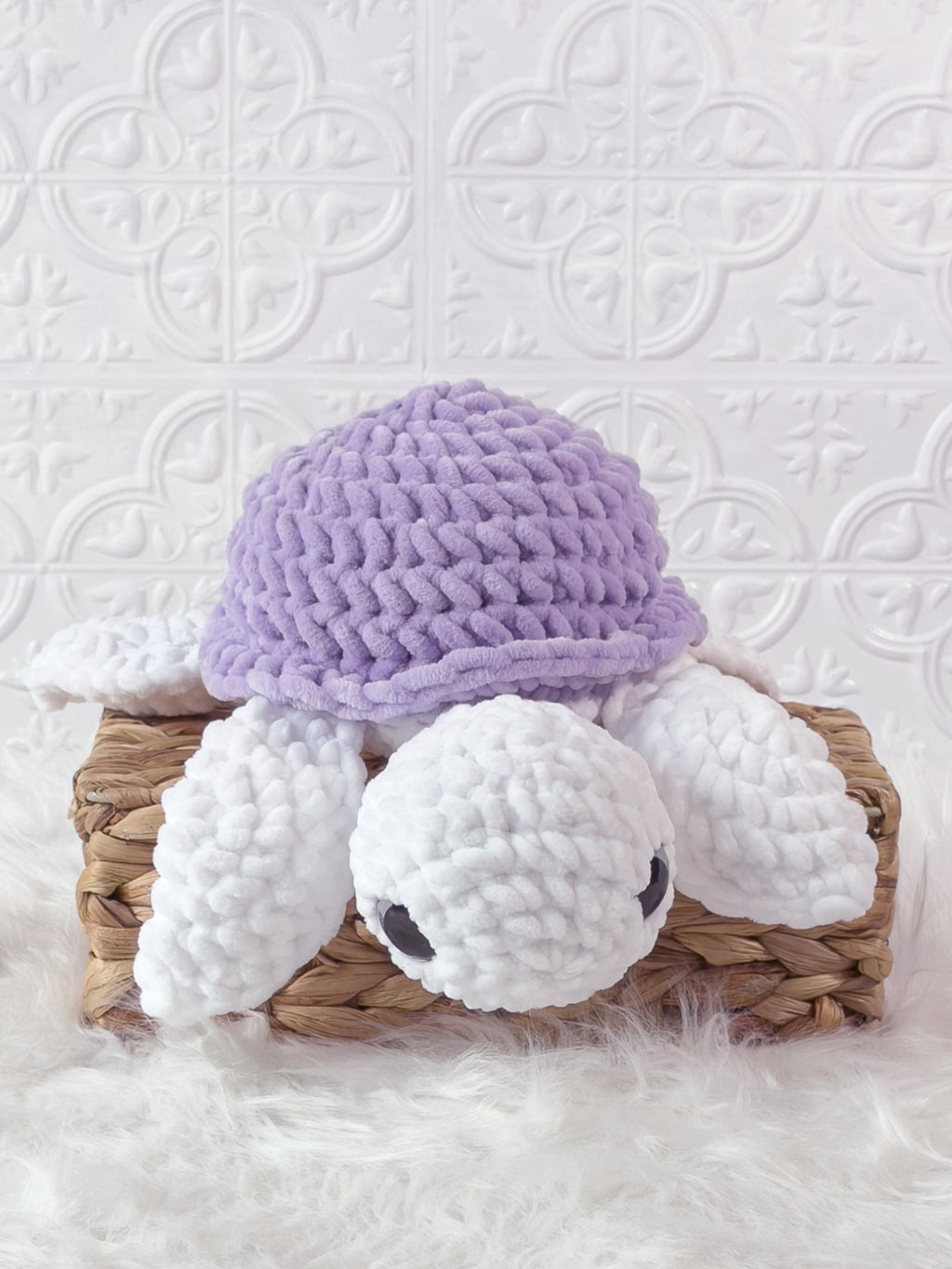 Handmade purple turtle crochet plushie shown from the front