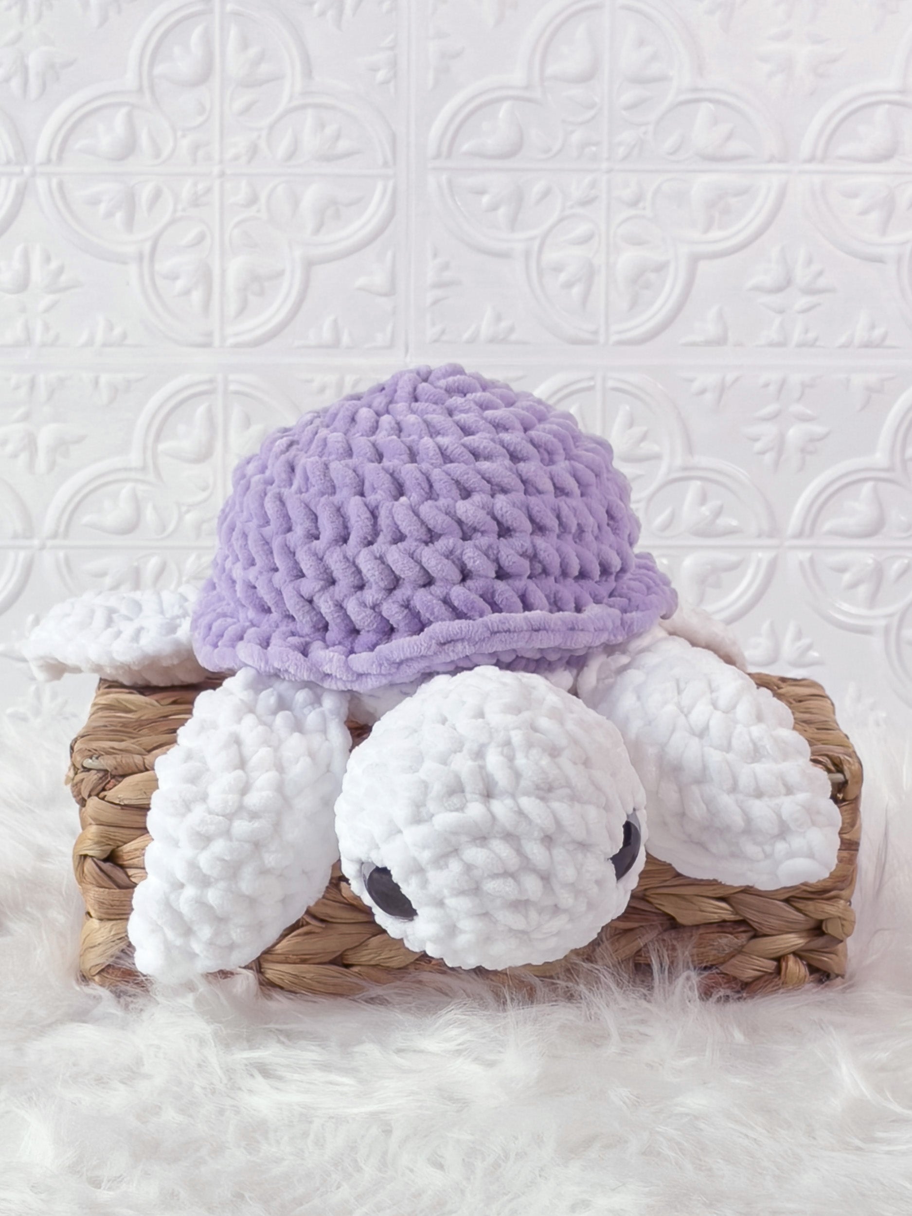 Handmade purple turtle crochet plushie shown from the front