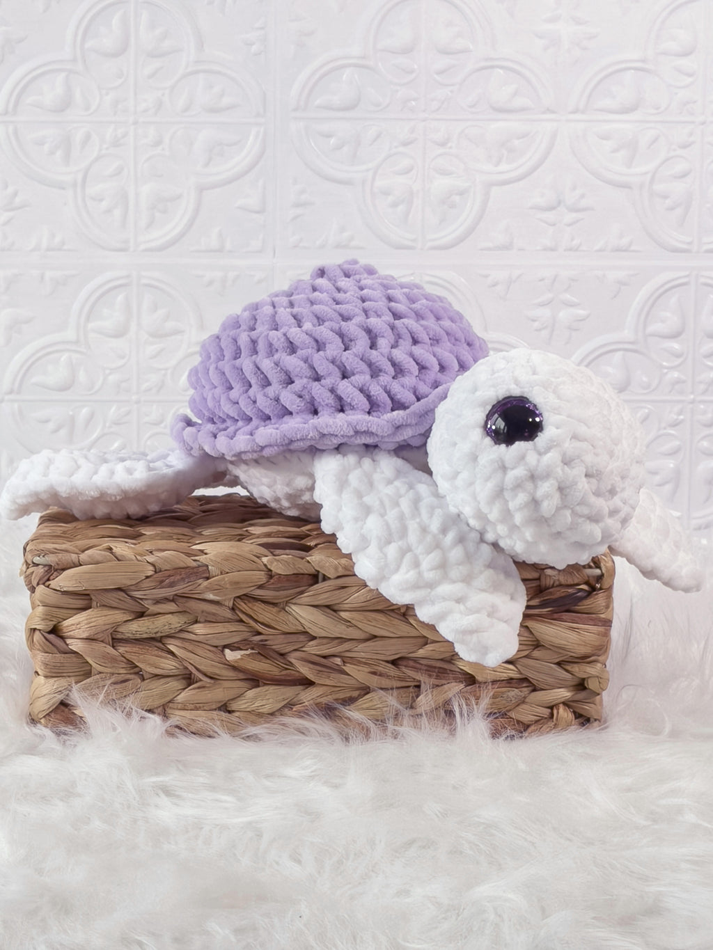 Handmade purple turtle crochet plushie shown from the side