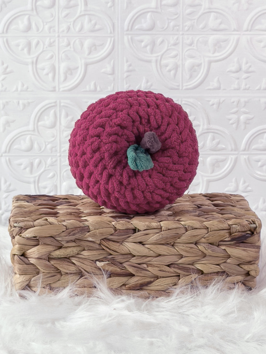 Handmade red apple crochet plushie shown from the front