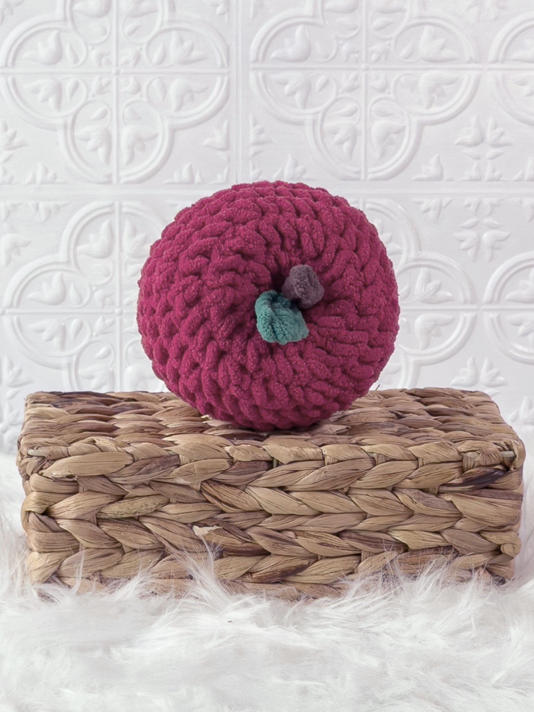 Handmade red apple crochet plushie shown from the front