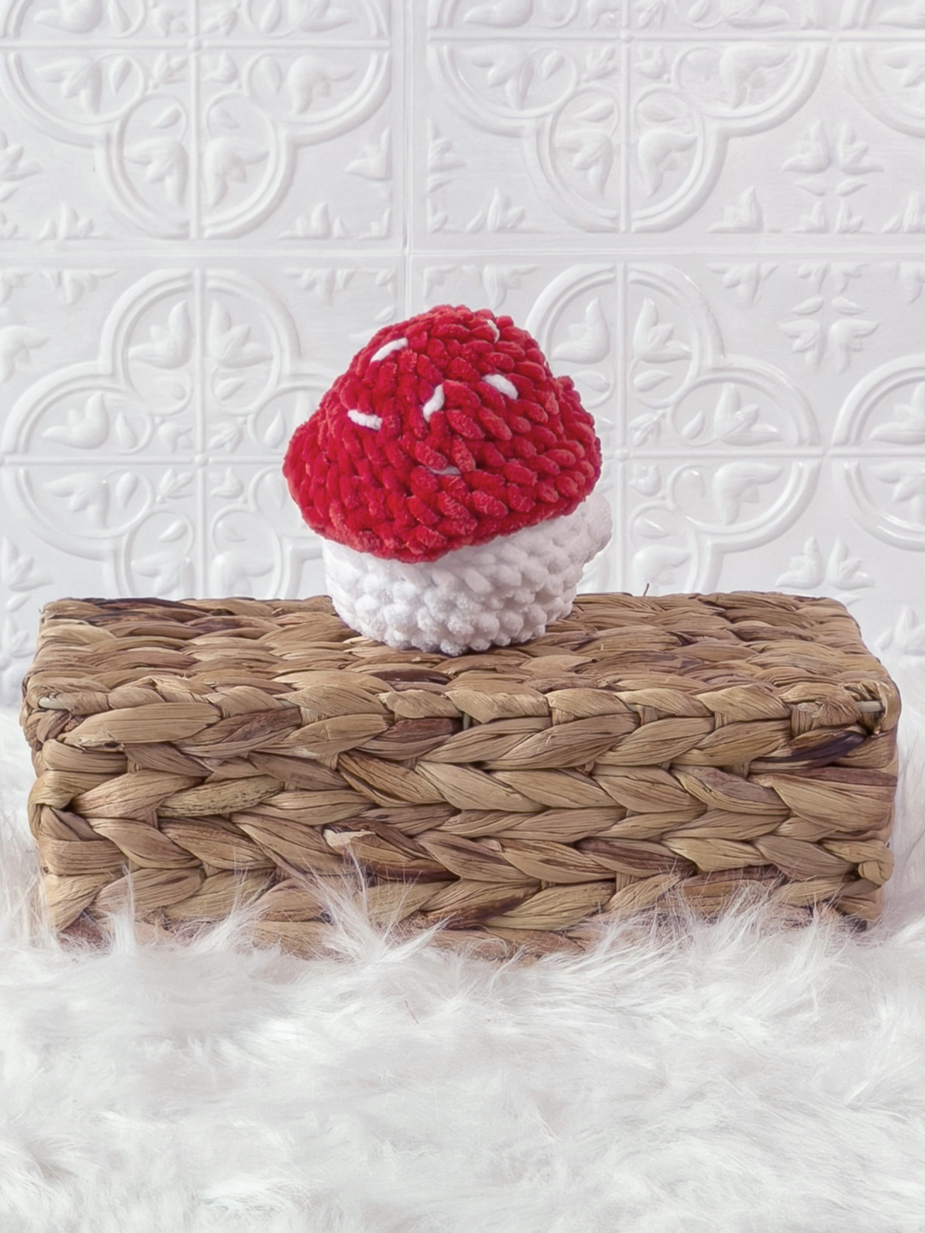 Handmade red chonky mushroom crochet plushie shown from the back