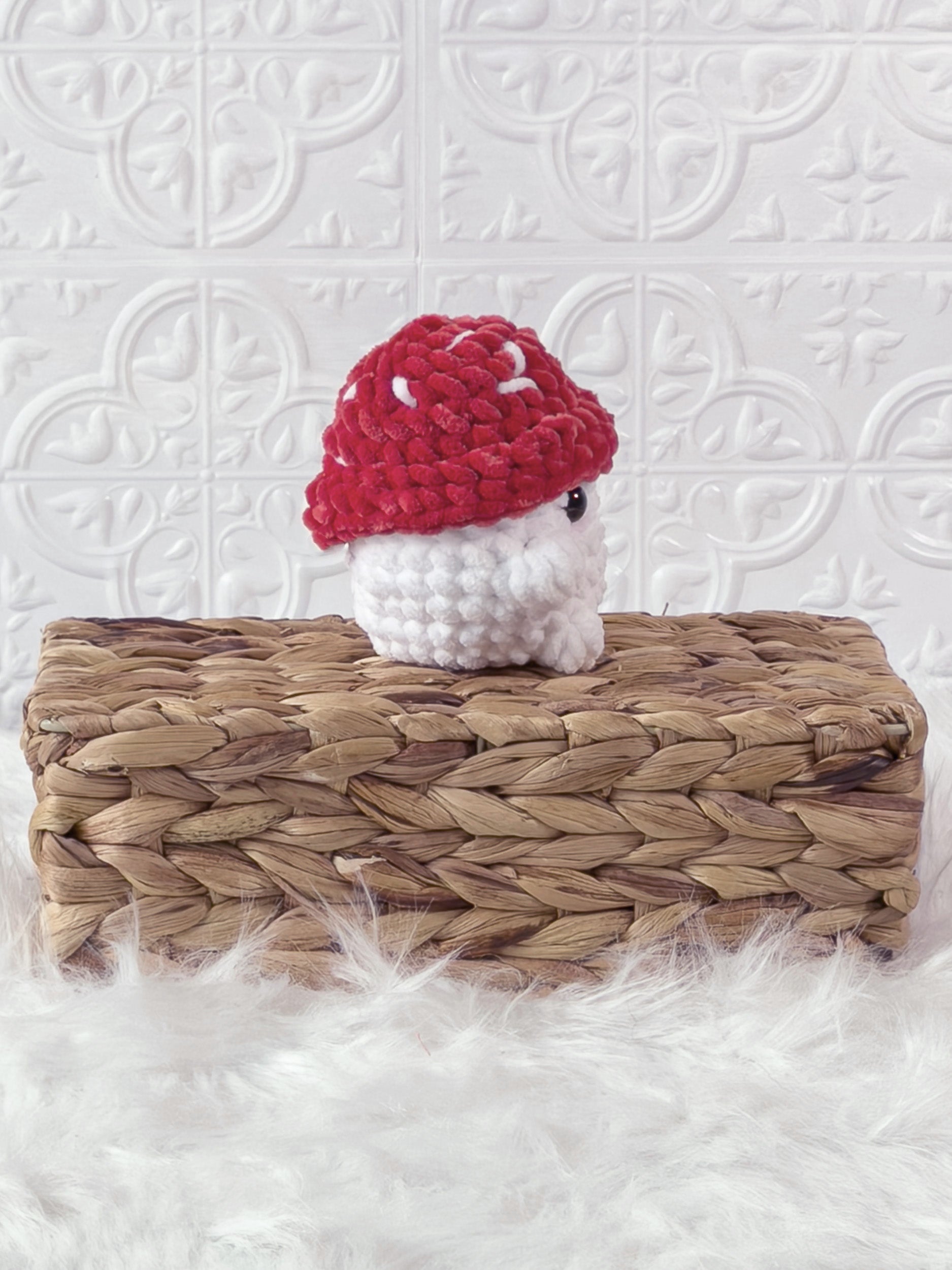Handmade red chonky mushroom crochet plushie shown from the side