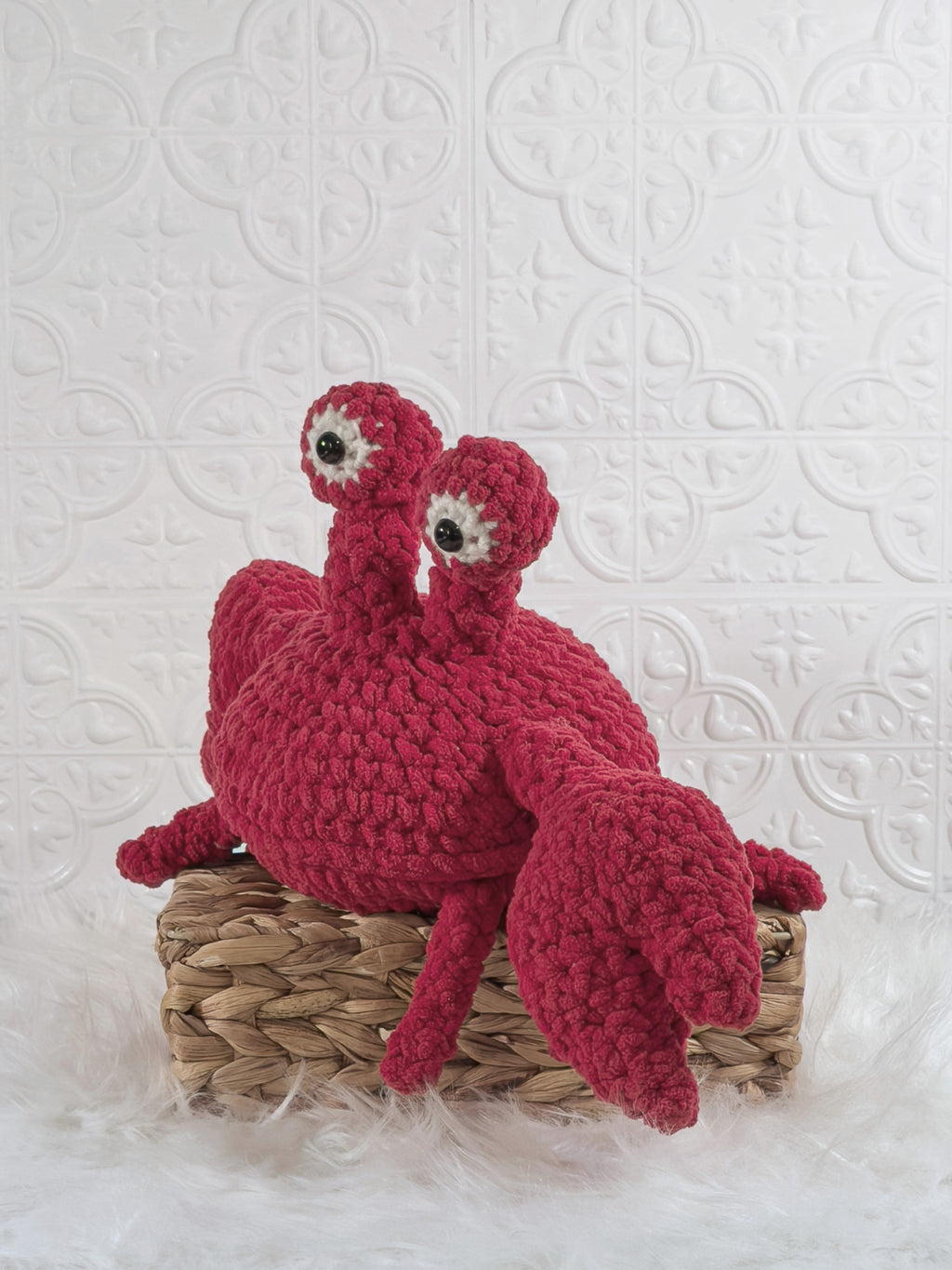 Handmade crab crochet plushie shown from the front